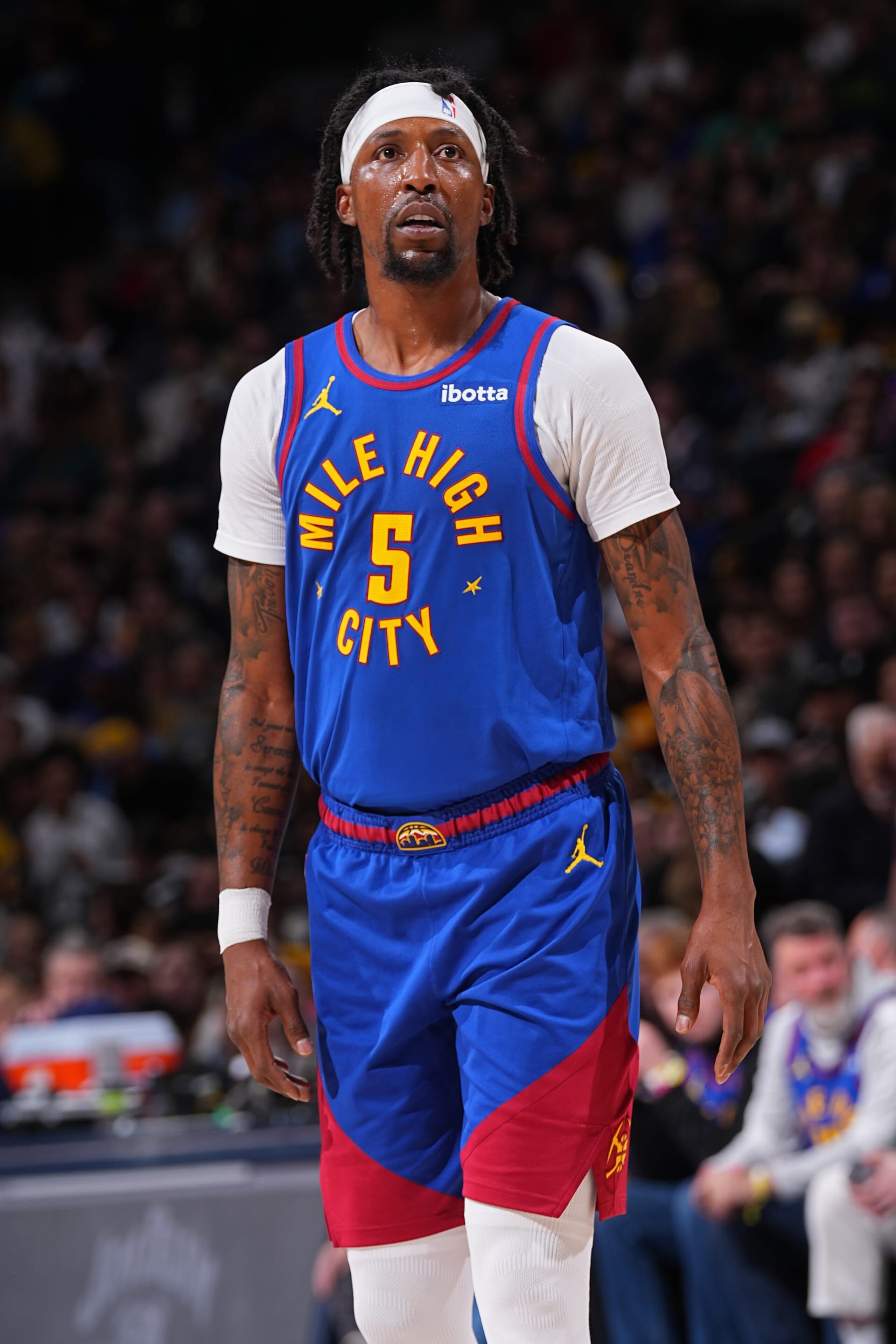 DENVER, CO - JANUARY 5: Kentavious Caldwell-Pope #5 of the Denver Nuggets looks on during the game against the Orlando Magic on January 5, 2024 at the Ball Arena in Denver, Colorado. NOTE TO USER: User expressly acknowledges and agrees that, by downloading and/or using this Photograph, user is consenting to the terms and conditions of the Getty Images License Agreement. Mandatory Copyright Notice: Copyright 2024 NBAE (Photo by Bart Young/NBAE via Getty Images)