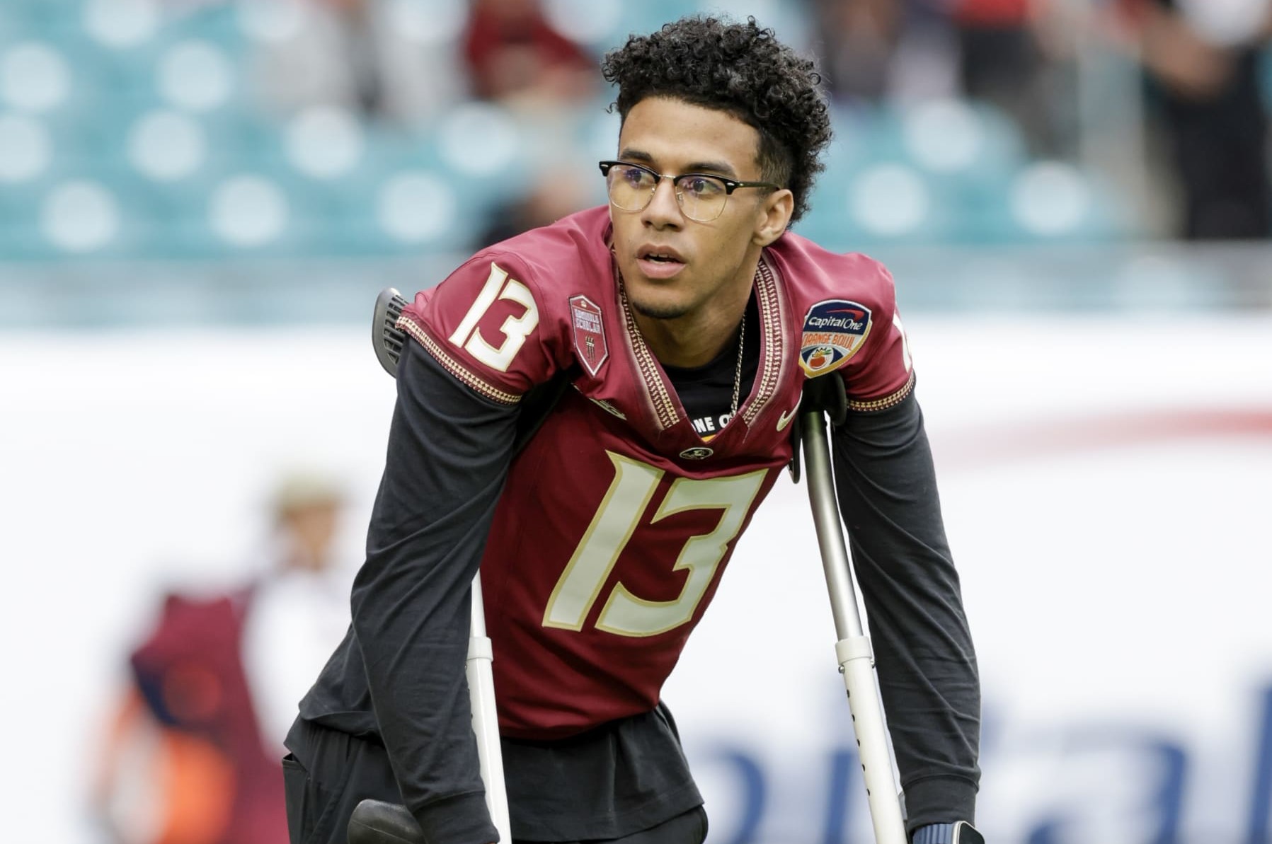 MIAMI GARDENS, FL - DECEMBER 30: Florida State Seminoles quarterback Jordan Travis (13) looks on before the game between the Georgia Bulldogs and the Florida State Seminoles on December 30, 2023 at Hard Rock Stadium in Miami Gardens, Fl.  (Photo by David Rosenblum/Icon Sportswire via Getty Images)