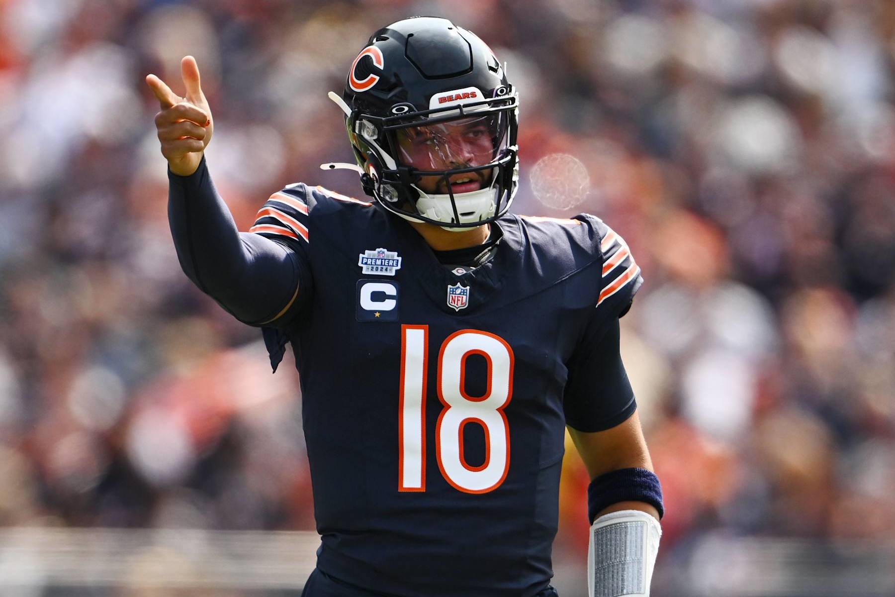 CHICAGO, ILLINOIS - SEPTEMBER 08: Caleb Williams #18 of the Chicago Bears gestures for a first down after a play in the first quarter of the game against the Tennessee Titans at Soldier Field on September 08, 2024 in Chicago, Illinois. (Photo by Quinn Harris/Getty Images)