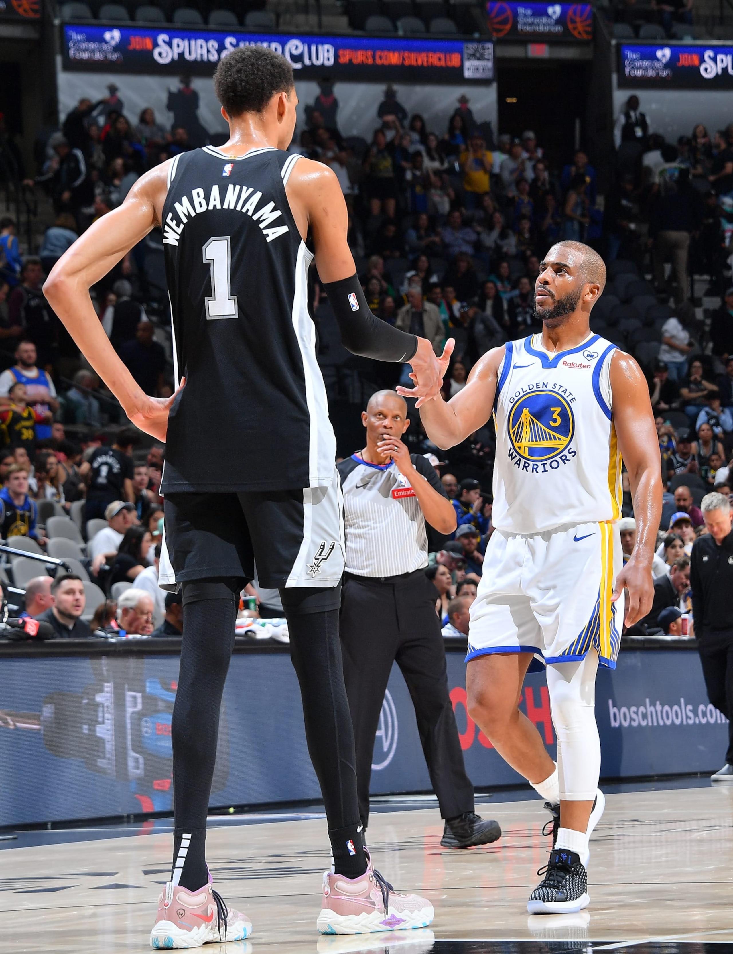SAN ANTONIO, TX - MARCH 11:  Victor Wembanyama #1 of the San Antonio Spurs and Chris Paul #3 of the Golden State Warriors shake hands after the game on March 11, 2024 at the Frost Bank Center in San Antonio, Texas. NOTE TO USER: User expressly acknowledges and agrees that, by downloading and or using this photograph, user is consenting to the terms and conditions of the Getty Images License Agreement. Mandatory Copyright Notice: Copyright 2024 NBAE (Photos by Michael Gonzales/NBAE via Getty Images)