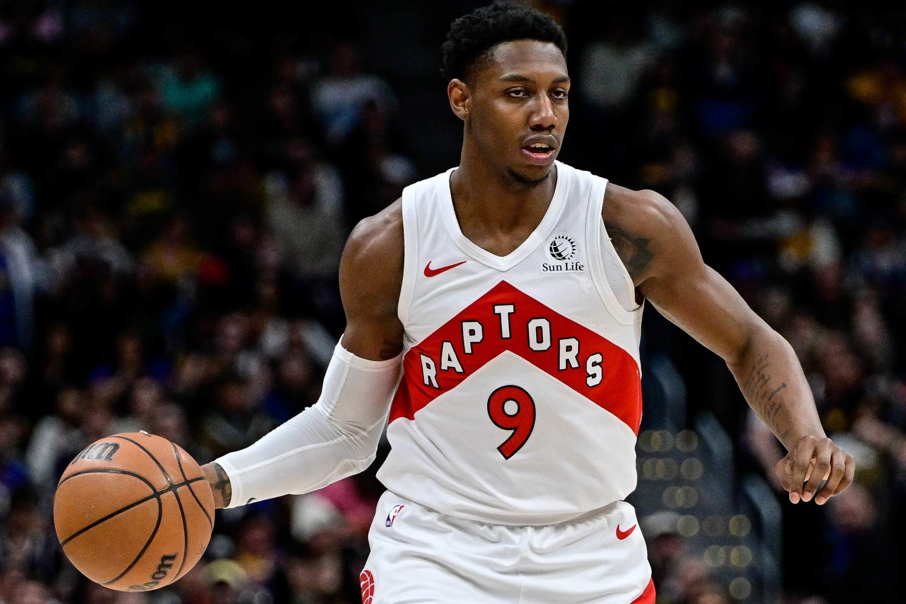 DENVER, COLORADO - MARCH 11: RJ Barrett #9 of the Toronto Raptors dribbles against the Denver Nuggets in the second half of a game at Ball Arena on March 11, 2024 in Denver, Colorado. NOTE TO USER: User expressly acknowledges and agrees that, by downloading and or using this photograph, User is consenting to the terms and conditions of the Getty Images License Agreement.  (Photo by Dustin Bradford/Getty Images)