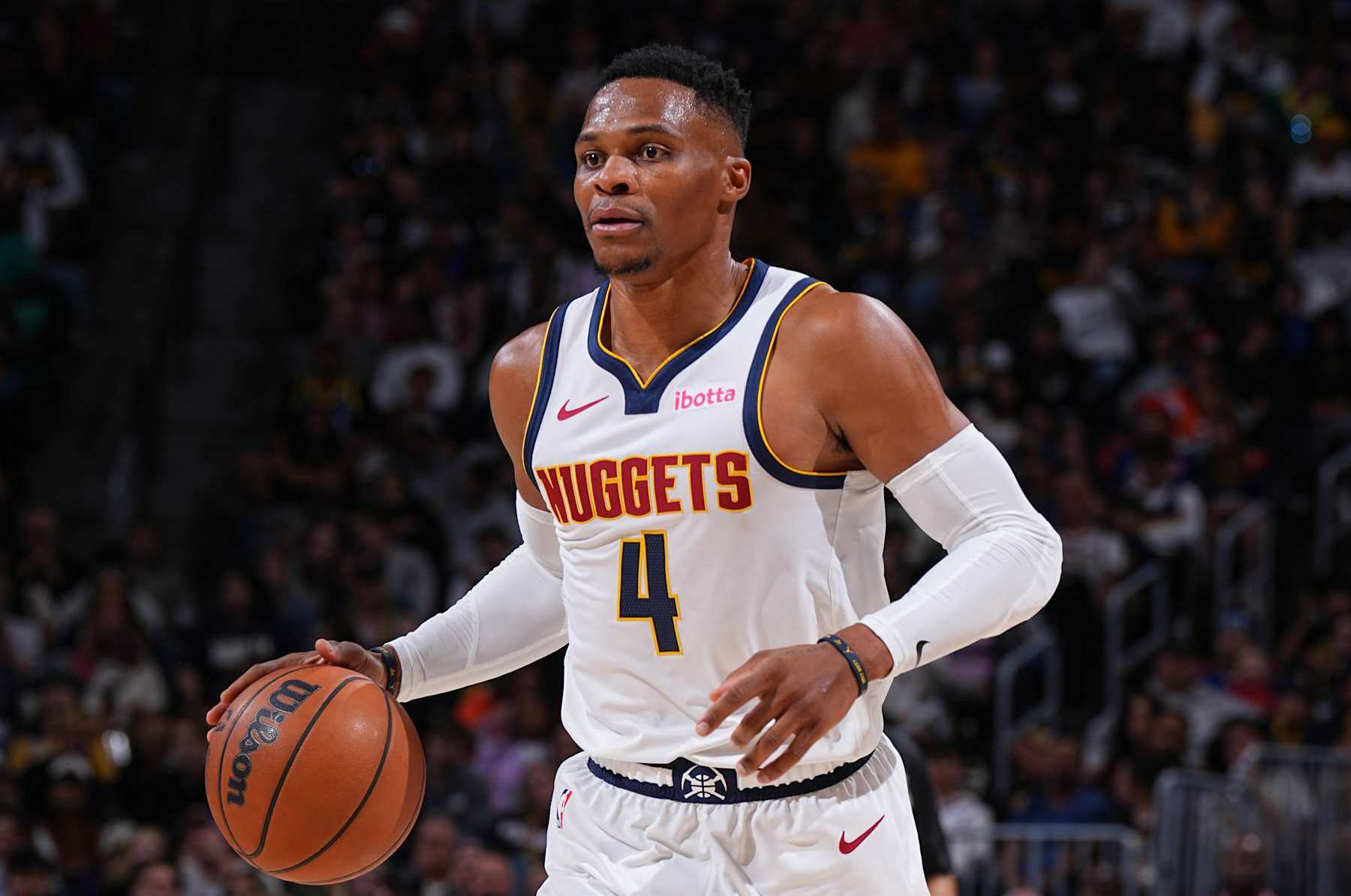 DENVER, CO - OCTOBER 13: Russell Westbrook #4 of the Denver Nuggets dribbles the ball during the game against the Phoenix Suns on October 13, 2024 at Ball Arena in Denver, Colorado. NOTE TO USER: User expressly acknowledges and agrees that, by downloading and/or using this Photograph, user is consenting to the terms and conditions of the Getty Images License Agreement. Mandatory Copyright Notice: Copyright 2024 NBAE (Photo by Garrett Ellwood/NBAE via Getty Images)