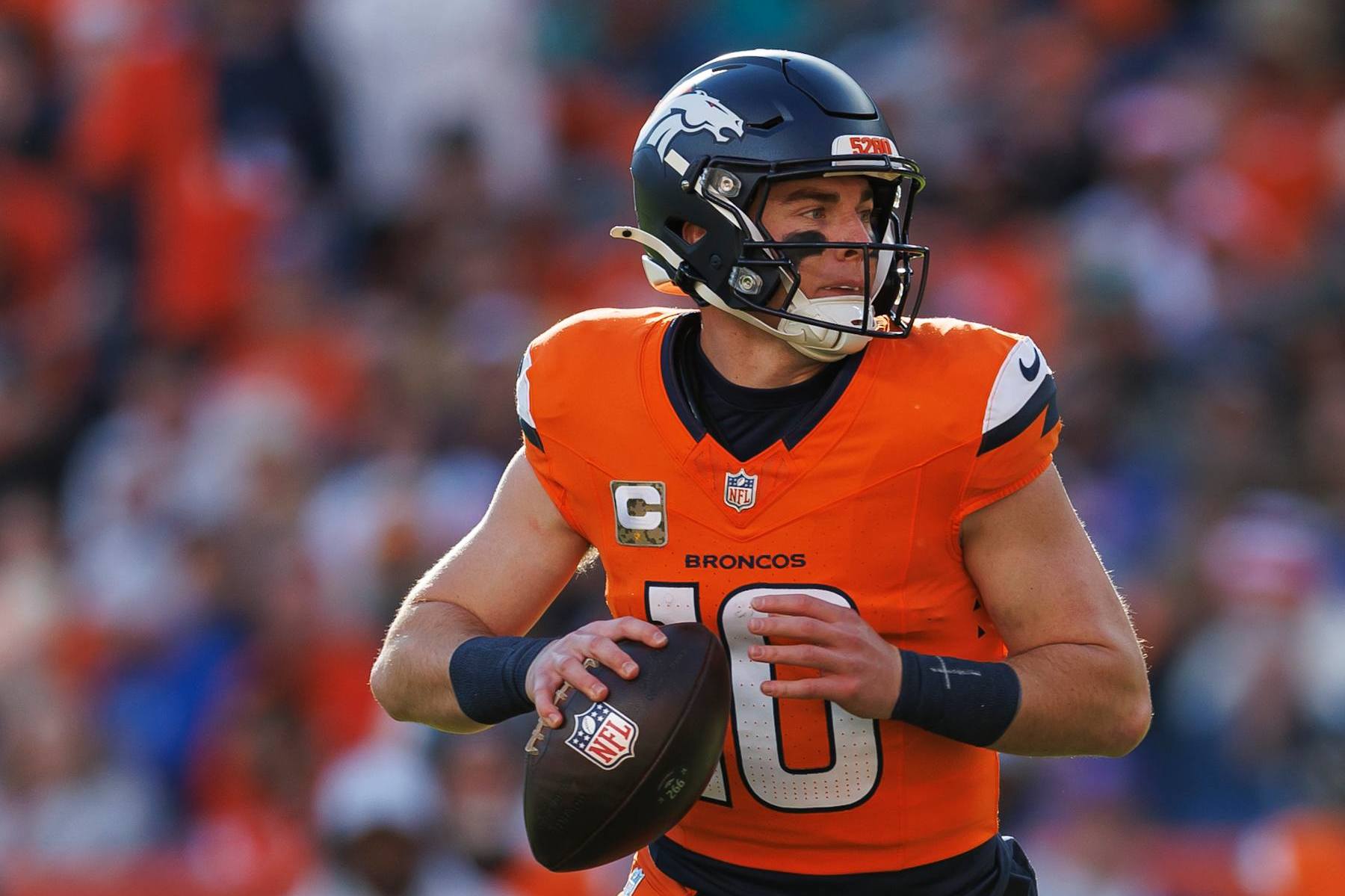 DENVER, COLORADO - NOVEMBER 17: Quarterback Bo Nix #10 of the Denver Broncos drops back to pass during the first half of an NFL football game against the Atlanta Falcons, at Empower Field at Mile High on November 17, 2024 in Denver, Colorado. (Photo by Brooke Sutton/Getty Images)