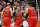 ORLANDO, FLORIDA - NOVEMBER 26: Lonzo Ball #2 of the Chicago Bulls is helped up by teammates Alex Caruso #6 and Nikola Vucevic #9 during the second quarter against the Orlando Magic at Amway Center on November 26, 2021 in Orlando, Florida. NOTE TO USER: User expressly acknowledges and agrees that, by downloading and or using this photograph, User is consenting to the terms and conditions of the Getty Images License Agreement. (Photo by Douglas P. DeFelice/Getty Images)