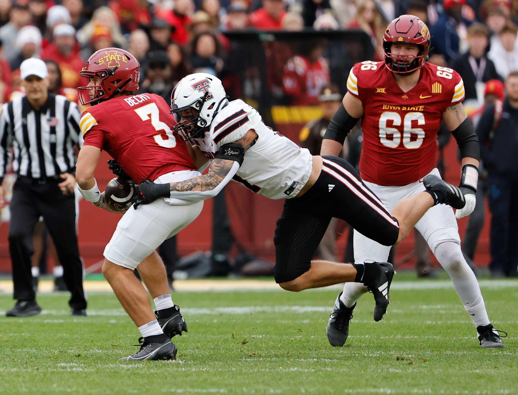 AMES, IA - NOVEMBER 2: Linebacker Isaac Smith #17 of the Texas Tech Red Raiders sacks quarterback Rocco Becht #3 of the Iowa State Cyclones as offensive lineman Tyler Miller #66 of the Iowa State Cyclones defends in the first half of play at Jack Trice Stadium on November 2, 2024, in Ames, Iowa. (Photo by David Purdy/Getty Images)