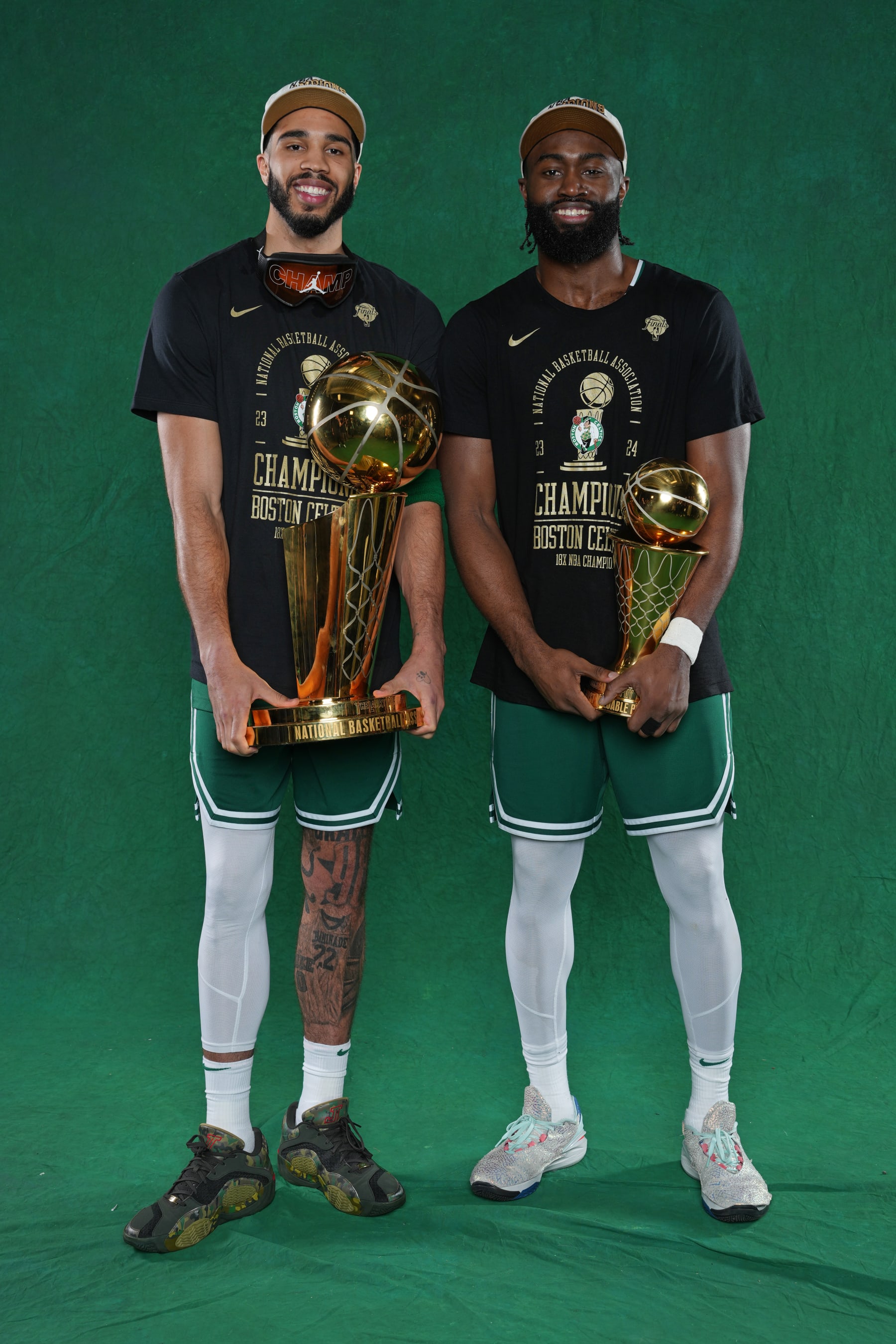 BOSTON, MA - JUNE 17: Jayson Tatum #0 and Jaylen Brown #7 of the Boston Celtics pose for a portrait with the Larry O'Brian Trophy and with the The Bill Russell Finals MVP Trophy after winning Game 5 of the 2024 NBA Finals on June 17, 2024 at the TD Garden in Boston, Massachusetts. NOTE TO USER: User expressly acknowledges and agrees that, by downloading and or using this photograph, User is consenting to the terms and conditions of the Getty Images License Agreement. Mandatory Copyright Notice: Copyright 2024 NBAE (Photo by Jesse D. Garrabrant/NBAE via Getty Images)