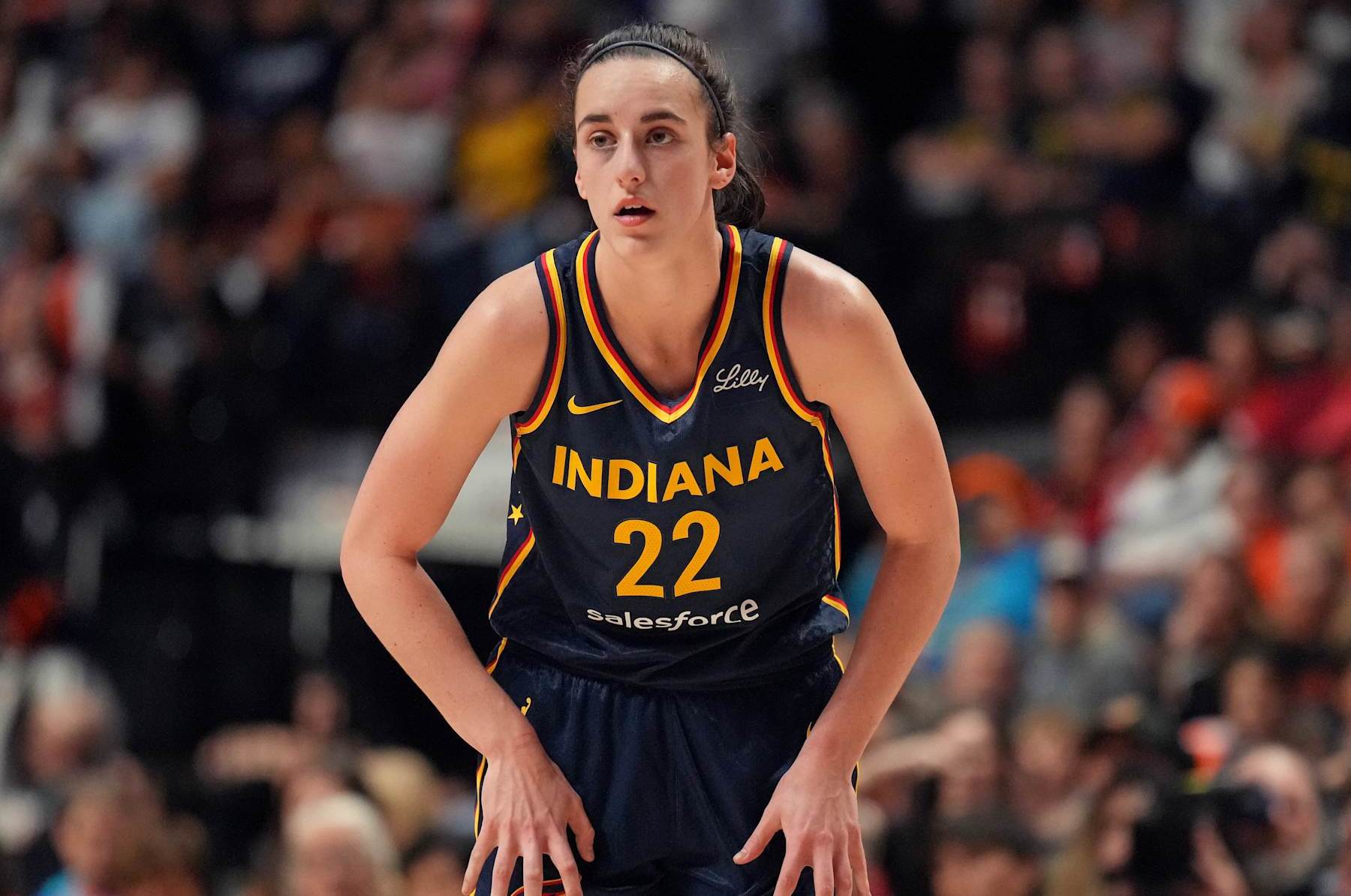UNCASVILLE, CT - SEPTEMBER 22: Caitlin Clark #22 of the Indiana Fever looks on during the game against the Connecticut Sun during round one game one of the 2024 WNBA Playoffs on September 22, 2024 at the Mohegan Sun Arena in Uncasville, Connecticut. NOTE TO USER: User expressly acknowledges and agrees that, by downloading and or using this photograph, User is consenting to the terms and conditions of the Getty Images License Agreement. Mandatory Copyright Notice: Copyright 2024 NBAE (Photo by Jesse D. Garrabrant/NBAE via Getty Images)