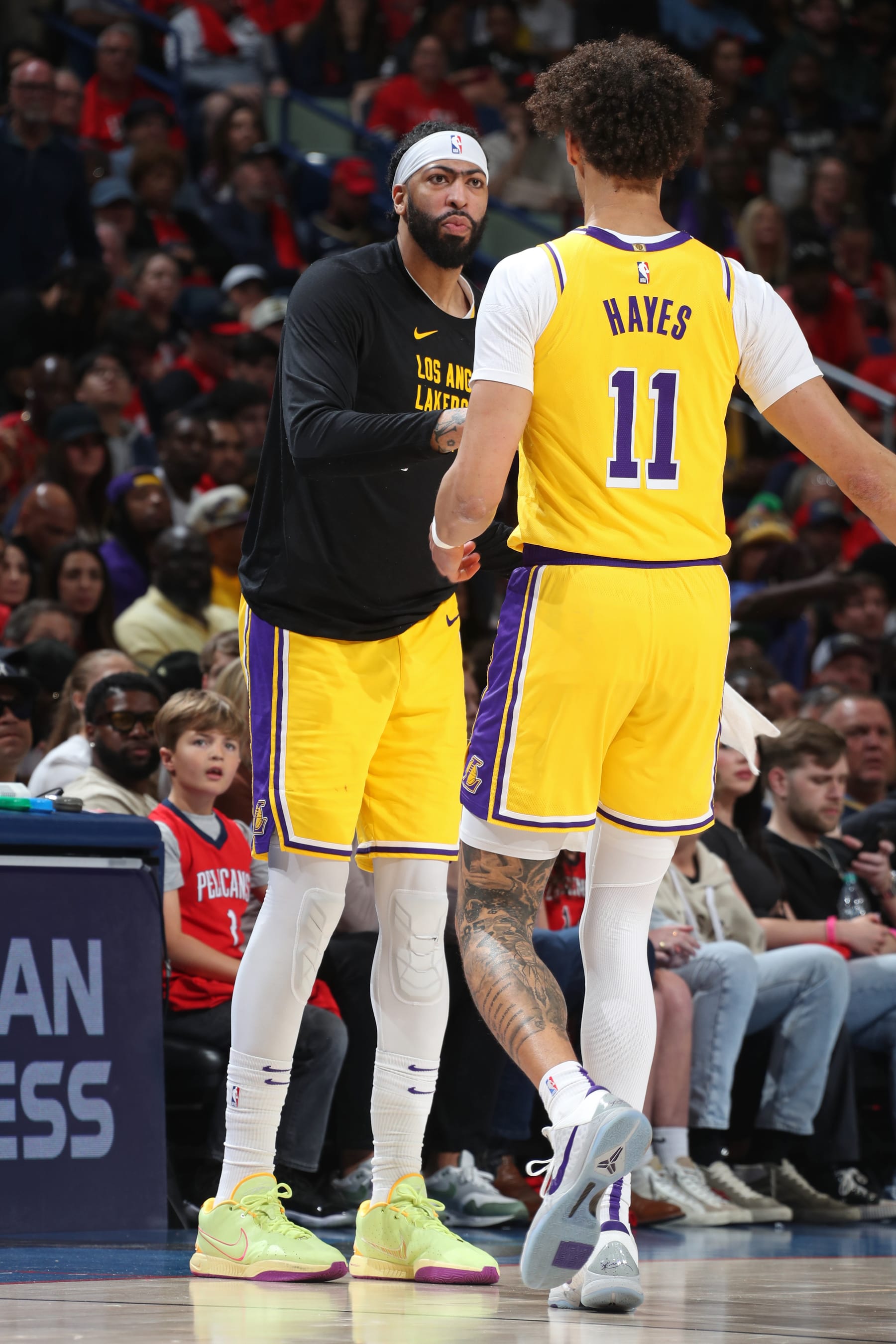 NEW ORLEANS, LA - APRIL 16: Anthony Davis #3 of the Los Angeles Lakers high fives Jaxson Hayes #11 during the game against the New Orleans Pelicans during the 2024 SoFi Play-In Tournament on April 16, 2024 at the Smoothie King Center in New Orleans, Louisiana. NOTE TO USER: User expressly acknowledges and agrees that, by downloading and or using this Photograph, user is consenting to the terms and conditions of the Getty Images License Agreement. Mandatory Copyright Notice: Copyright 2024 NBAE (Photo by Layne Murdoch Jr./NBAE via Getty Images)