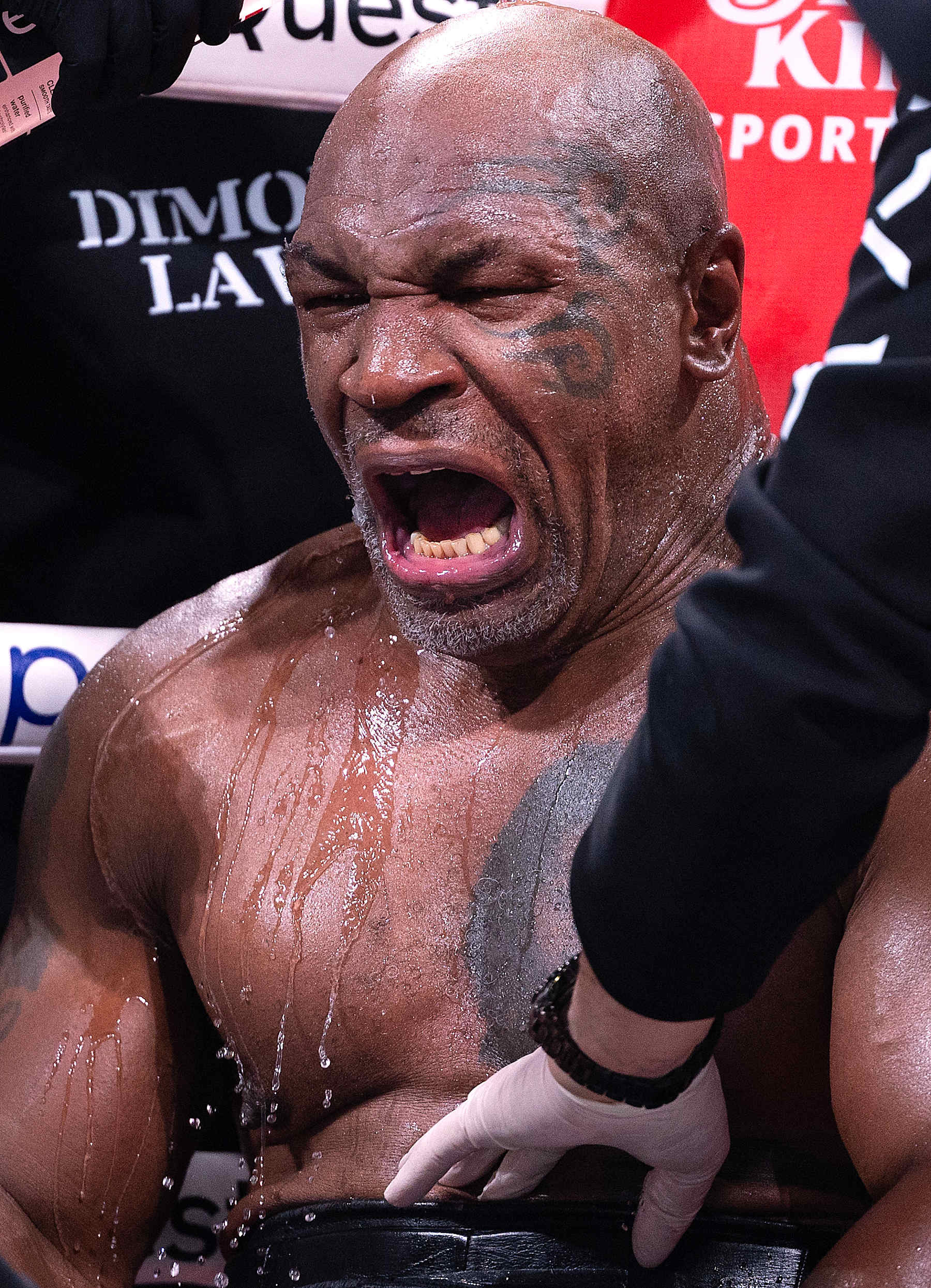 ARLINGTON, TEXAS - NOVEMBER 15:  Mike Tyson sits in his corner between rounds against Jake Paul during LIVE On Netflix: Jake Paul vs. Mike Tyson at AT&T Stadium on November 15, 2024 in Arlington, Texas.   (Photo by Al Bello/Getty Images for Netflix © 2024)