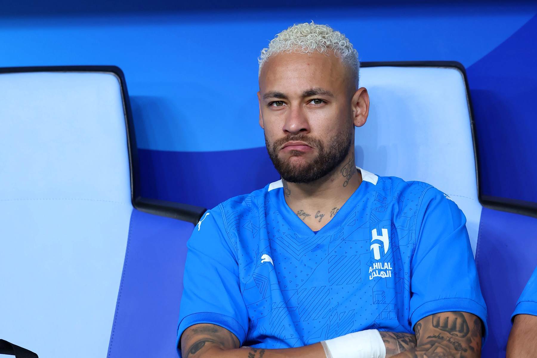 RIYADH, SAUDI ARABIA - NOVEMBER 04: Neymar of Al-Hilal reacts from the bench following an injury during the AFC Champions League Elite match between Al-Hilal and Esteghlal at Kingdom Arena on November 04, 2024 in Riyadh, Saudi Arabia. (Photo by Abdullah Ahmed/Getty Images)