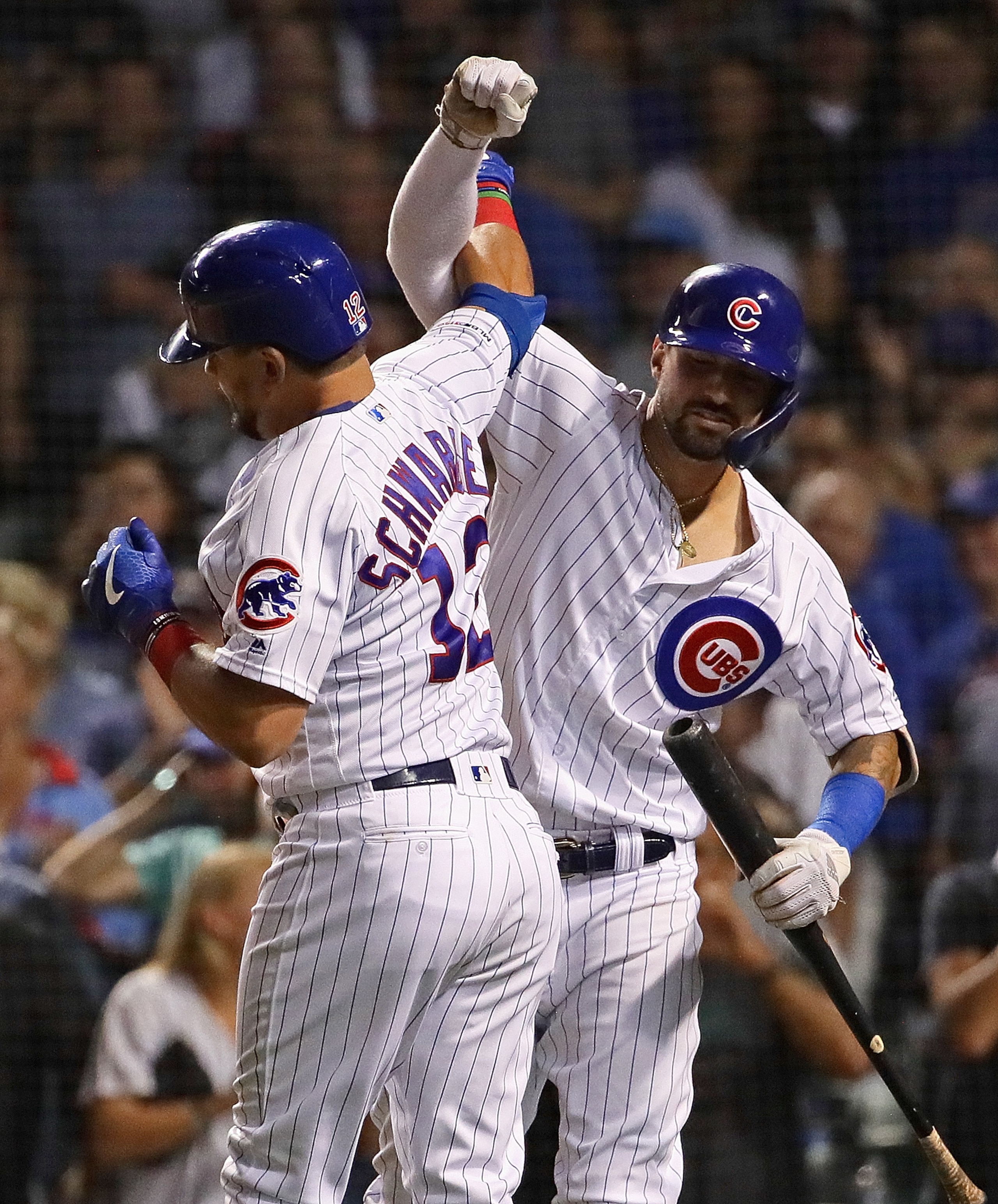 CHICAGO, ILLINOIS - SEPTEMBER 03: Kyle Schwarber #12 and Nicholas Castellanos #6 of the Chicago Cubs celebrate Schwarber's solo home run in the 7th inning against the Seattle Mariners at Wrigley Field on September 03, 2019 in Chicago, Illinois. (Photo by Jonathan Daniel/Getty Images)