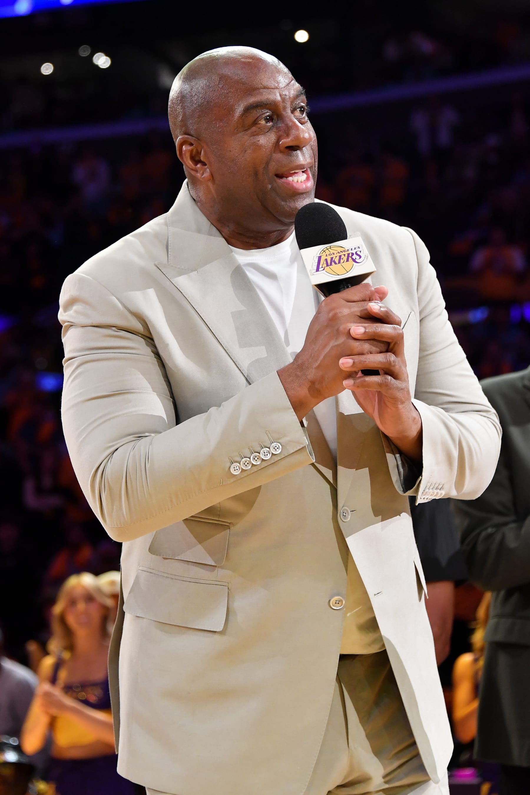 LOS ANGELES, CALIFORNIA - APRIL 25: Magic Johnson speaks during a ceremony celebrating Michael Cooper's induction into the basketball hall of fame at halftime of a basketball game between the Los Angeles Lakers and the Denver Nuggets at Crypto.com Arena on April 25, 2024 in Los Angeles, California. NOTE TO USER: User expressly acknowledges and agrees that, by downloading and or using this photograph, User is consenting to the terms and conditions of the Getty Images License Agreement.  (Photo by Allen Berezovsky/Getty Images)