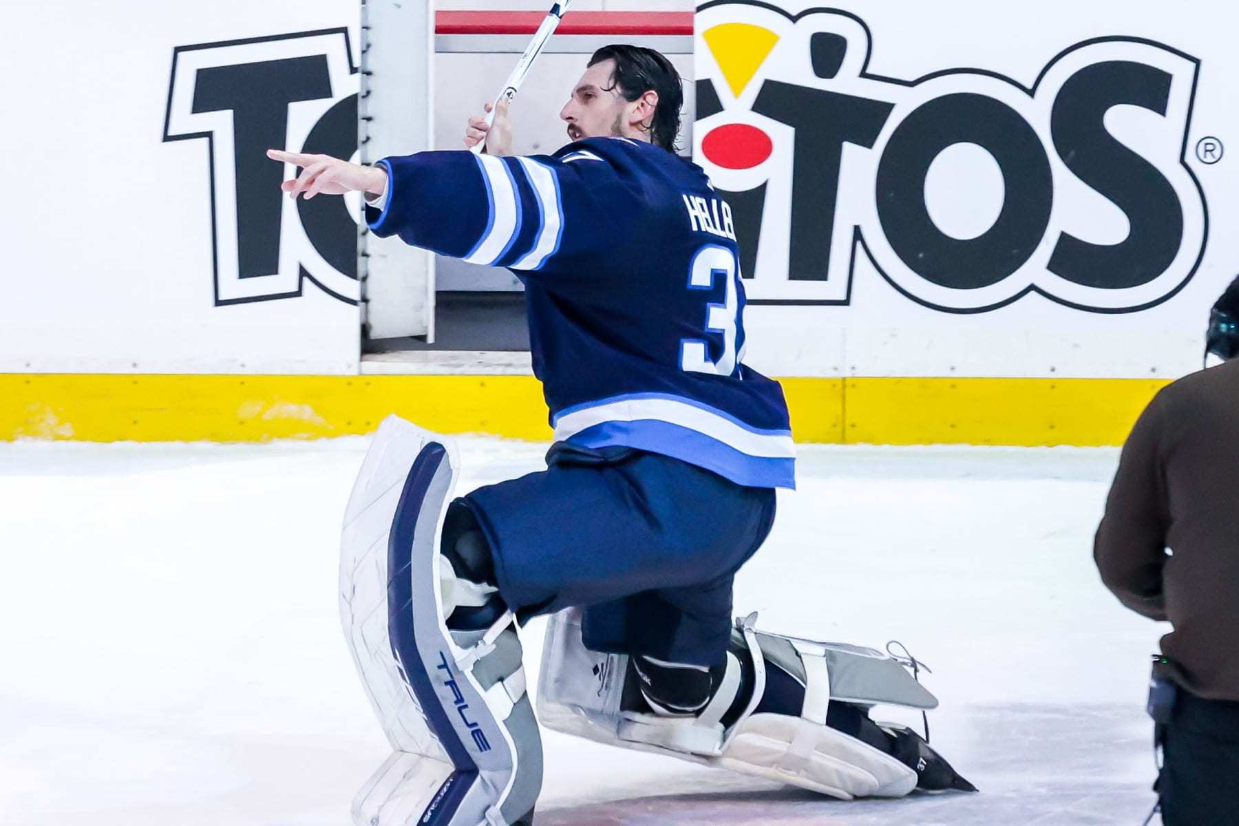 WINNIPEG, CANADA - JANUARY 9: Goaltender Connor Hellebuyck #37 of the Winnipeg Jets celebrates after receiving first star honours following a 5-0 shutout victory over the Columbus Blue Jackets at the Canada Life Centre on January 9, 2024 in Winnipeg, Manitoba, Canada. (Photo by Jonathan Kozub/NHLI via Getty Images)