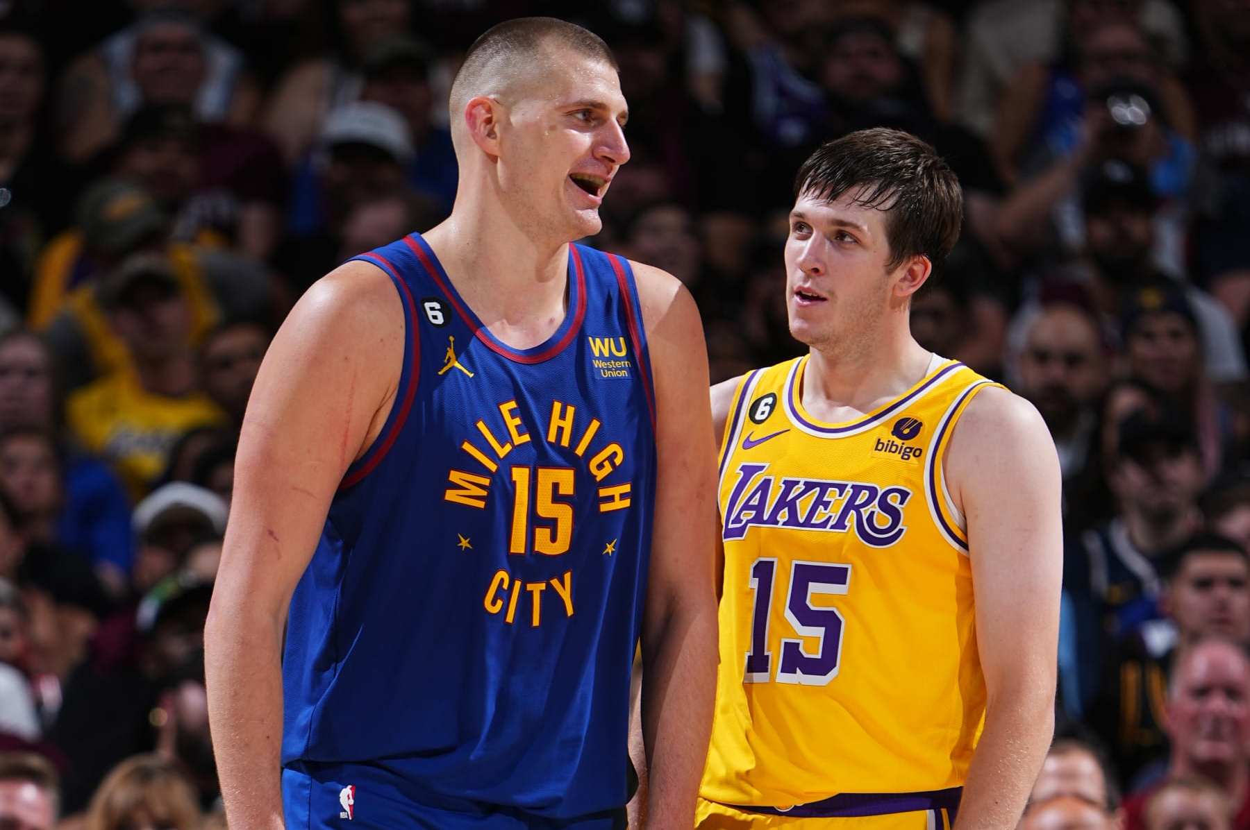 DENVER, CO -  MAY 16: Nikola Jokic #15 of the Denver Nuggets and Austin Reaves #15 of the Los Angeles Lakers look on during Round 3 Game 1 of the Western Conference Finals 2023 NBA Playoffs on May 16, 2023 at the Ball Arena in Denver, Colorado. NOTE TO USER: User expressly acknowledges and agrees that, by downloading and/or using this Photograph, user is consenting to the terms and conditions of the Getty Images License Agreement. Mandatory Copyright Notice: Copyright 2023 NBAE (Photo by Garrett Ellwood/NBAE via Getty Images)