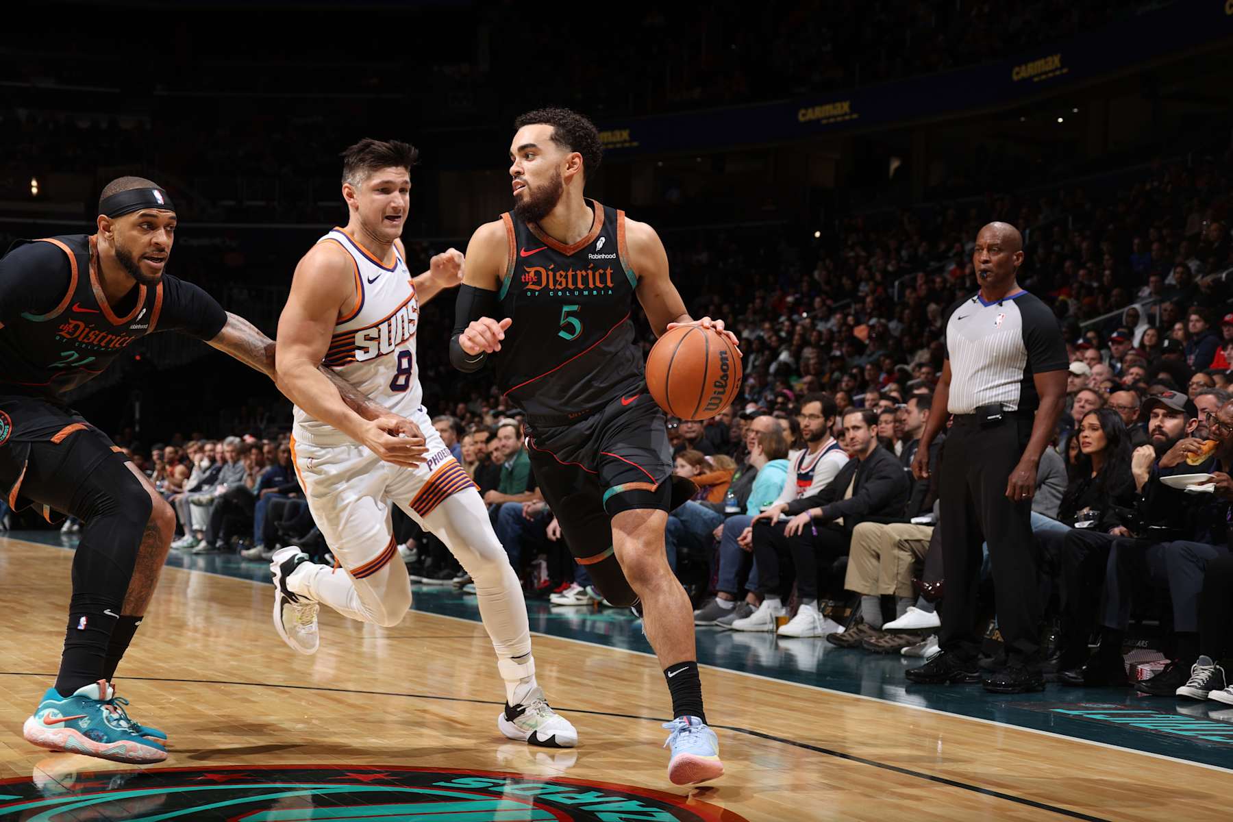 WASHINGTON, DC -  FEBRUARY 4: Tyus Jones #5 of the Washington Wizards dribbles the ball during the game against the Phoenix Suns on February 4, 2024 at Capital One Arena in Washington, DC. NOTE TO USER: User expressly acknowledges and agrees that, by downloading and or using this Photograph, user is consenting to the terms and conditions of the Getty Images License Agreement. Mandatory Copyright Notice: Copyright 2024 NBAE (Photo by Stephen Gosling/NBAE via Getty Images)