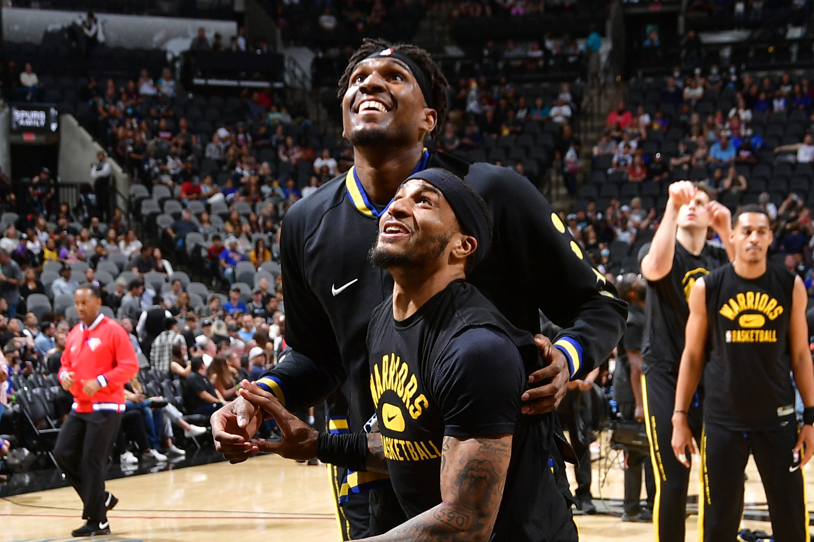 SAN ANTONIO, TX -APRIL 9: Kevon Looney #5 of the Golden State Warriors and Gary Payton II #0 of the Golden State Warriors smile before the game against the San Antonio Spurs on April 9, 2022 at the AT&T Center in San Antonio, Texas. NOTE TO USER: User expressly acknowledges and agrees that, by downloading and or using this photograph, user is consenting to the terms and conditions of the Getty Images License Agreement. Mandatory Copyright Notice: Copyright 2022 NBAE (Photos by Michael Gonzales/NBAE via Getty Images)