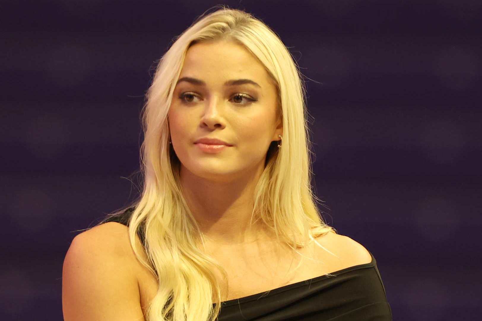 BATON ROUGE, LOUISIANA - SEPTEMBER 4: LSU Tigers gymnast Livvy Dunne listen to the speakers during The Money Game World Premiere at Pete Maravich Assembly Center on September 4, 2024 in Baton Rouge, Louisiana. (Photo by Peter Forest/Getty Images for Prime Video)