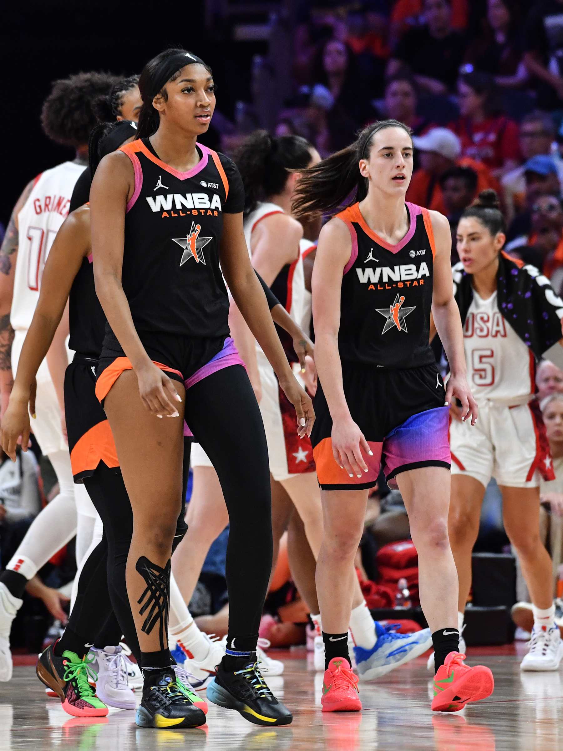 PHOENIX, AZ - JULY 20: Angel Reese #5, and Caitlin Clark #22 of Team WNBA walk during the 2024 WNBA All Star Game on July 20, 2024 at Footprint Center in Phoenix, Arizona. NOTE TO USER: User expressly acknowledges and agrees that, by downloading and or using this photograph, user is consenting to the terms and conditions of the Getty Images License Agreement. Mandatory Copyright Notice: Copyright 2024 NBAE (Photo by Juan Ocampo/NBAE via Getty Images)