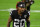 LAS VEGAS, NEVADA - DECEMBER 26: Cornerback Damon Arnette #20 of the Las Vegas Raiders runs on the field before a game against the Miami Dolphins at Allegiant Stadium on December 26, 2020 in Las Vegas, Nevada. The Dolphins defeated the Raiders 26-25. (Photo by Ethan Miller/Getty Images)