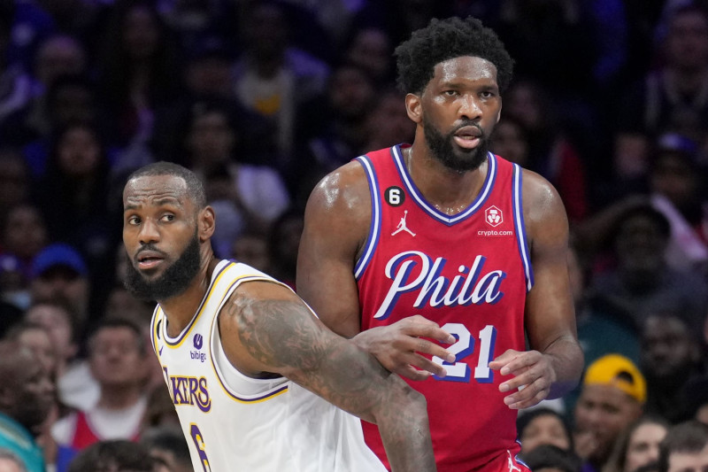 PHILADELPHIA, PA - DECEMBER 9: LeBron James #6 of the Los Angeles Lakers and Joel Embiid #21 of the Philadelphia 76ers look on during the game on December 9, 2022 at the Wells Fargo Center in Philadelphia, Pennsylvania NOTE TO USER: User expressly acknowledges and agrees that, by downloading and/or using this Photograph, user is consenting to the terms and conditions of the Getty Images License Agreement. Mandatory Copyright Notice: Copyright 2022 NBAE (Photo by Jesse D. Garrabrant/NBAE via Getty Images)