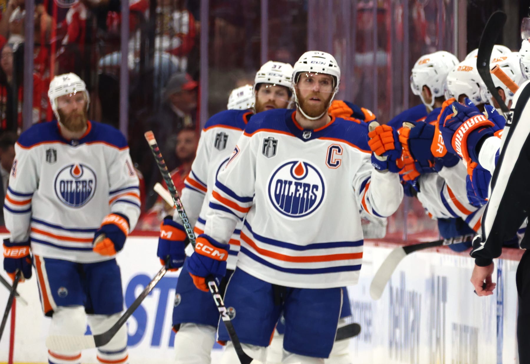 SUNRISE, FLORIDA - JUNE 18: Connor McDavid #97 of the Edmonton Oilers celebrates with teammates on the bench after scoring a goal during the second period of Game Five of the 2024 Stanley Cup Final between the Edmonton Oilers and the Florida Panthers at Amerant Bank Arena on June 18, 2024 in Sunrise, Florida.  (Photo by Dave Sandford/NHLI via Getty Images)