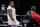 World Heavyweight boxing champion Britain's Anthony Joshua looks across at challenger Bulgaria's Kubrat Pulev before their Heavyweight title bout at Wembley Arena in London Saturday, Dec. 12, 2020. (Andrew Couldridge/Pool via AP)