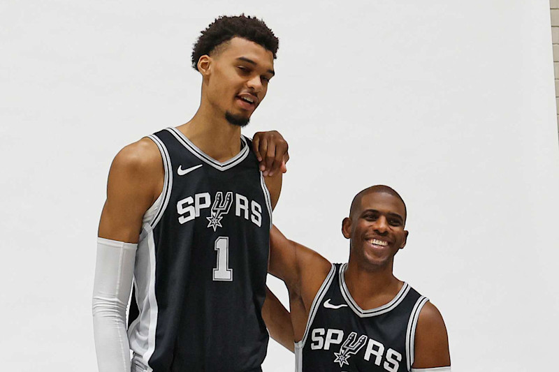 SAN ANTONIO, TX - SEPTEMBER 30: Victor Wembanyama #1 of the San Antonio Spurs and Chris Paul #3 prepare to have their photograph taken at the San Antonio Spurs Media Day at the Victory Capital Performance Center on September 30, 2024 in San Antonio, Texas. NOTE TO USER: User expressly acknowledges and agrees that, by downloading and or using this photograph, User is consenting to terms and conditions of the Getty Images License Agreement. (Photo by Ronald Cortes/Getty Images)