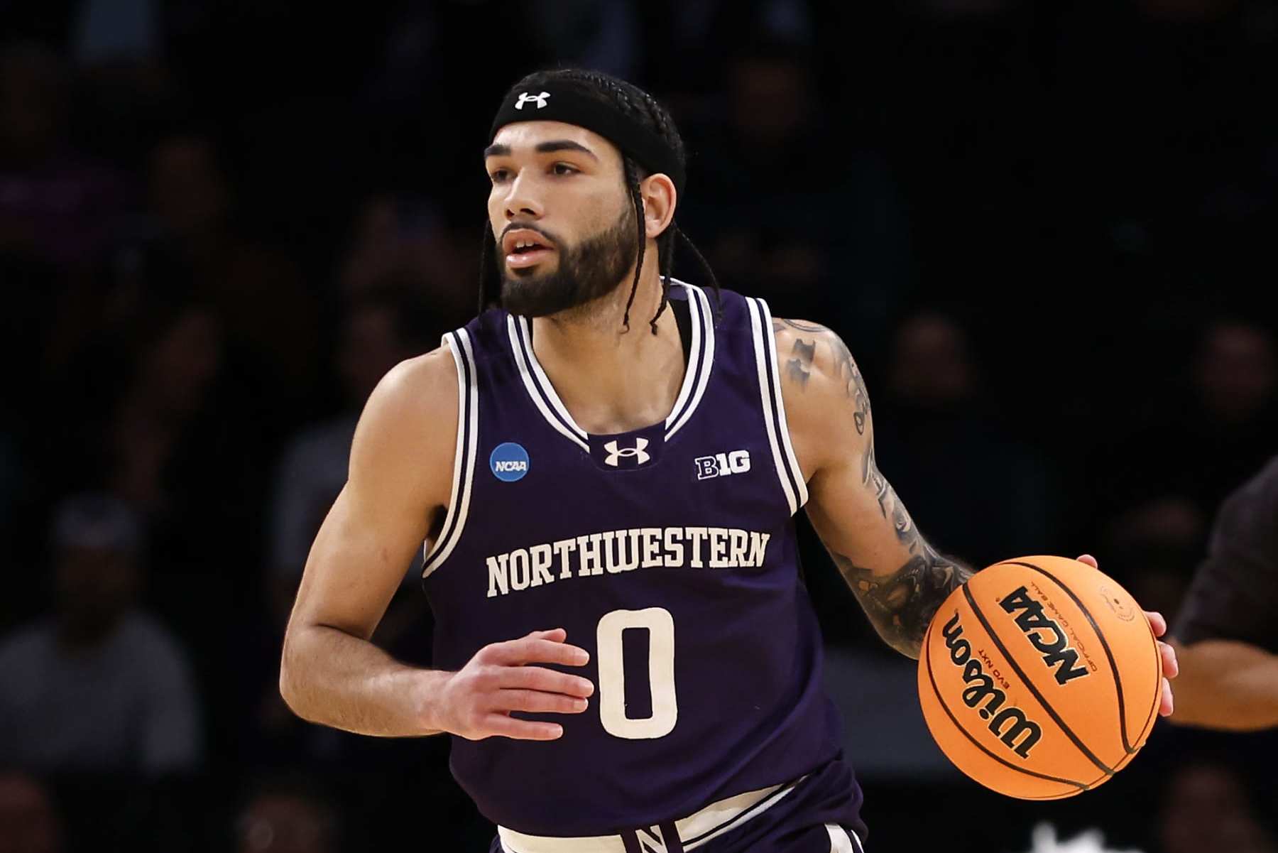 NEW YORK, NEW YORK - MARCH 22: Boo Buie #0 of the Northwestern Wildcats brings the ball up court in the first half against the Florida Atlantic Owls in the first round of the NCAA Men's Basketball Tournament at Barclays Center on March 22, 2024 in New York City. (Photo by Sarah Stier/Getty Images)
