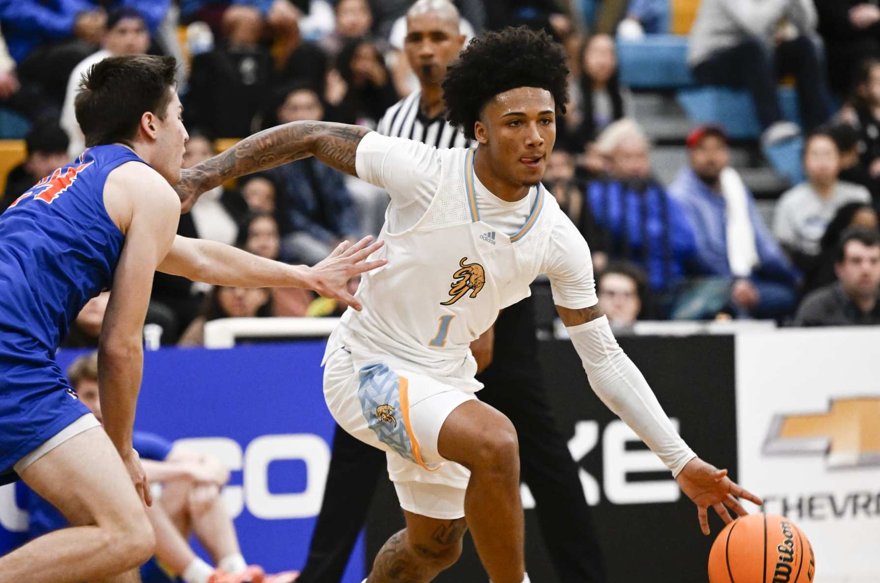 SAN DIEGO, CA - JANUARY 28: San Ysidros Mikey Williams drives past Las Vegas Bishop Gormans Ryder Elisaldez during the first quarter of a high school basketball game against at San Ysidro High School Jan. 28, 2023 in San Diego. (Photo by Denis Poroy/Getty Images)