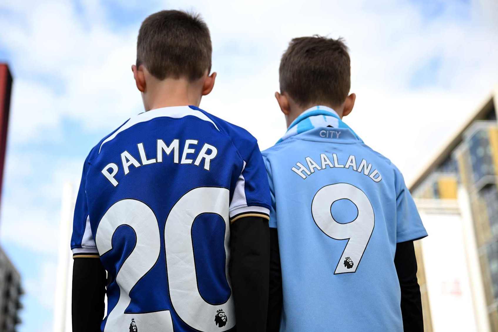 LONDON, ENGLAND - APRIL 20: Fan of Chelsea wearing a Cole Palmer shirt poses for a photo with a Manchester City fan wearing a Erling Haaland shirt outside the stadium prior to the Emirates FA Cup Semi Final match between Manchester City and Chelsea at Wembley Stadium on April 20, 2024 in London, England. (Photo by Justin Setterfield - The FA/The FA via Getty Images)