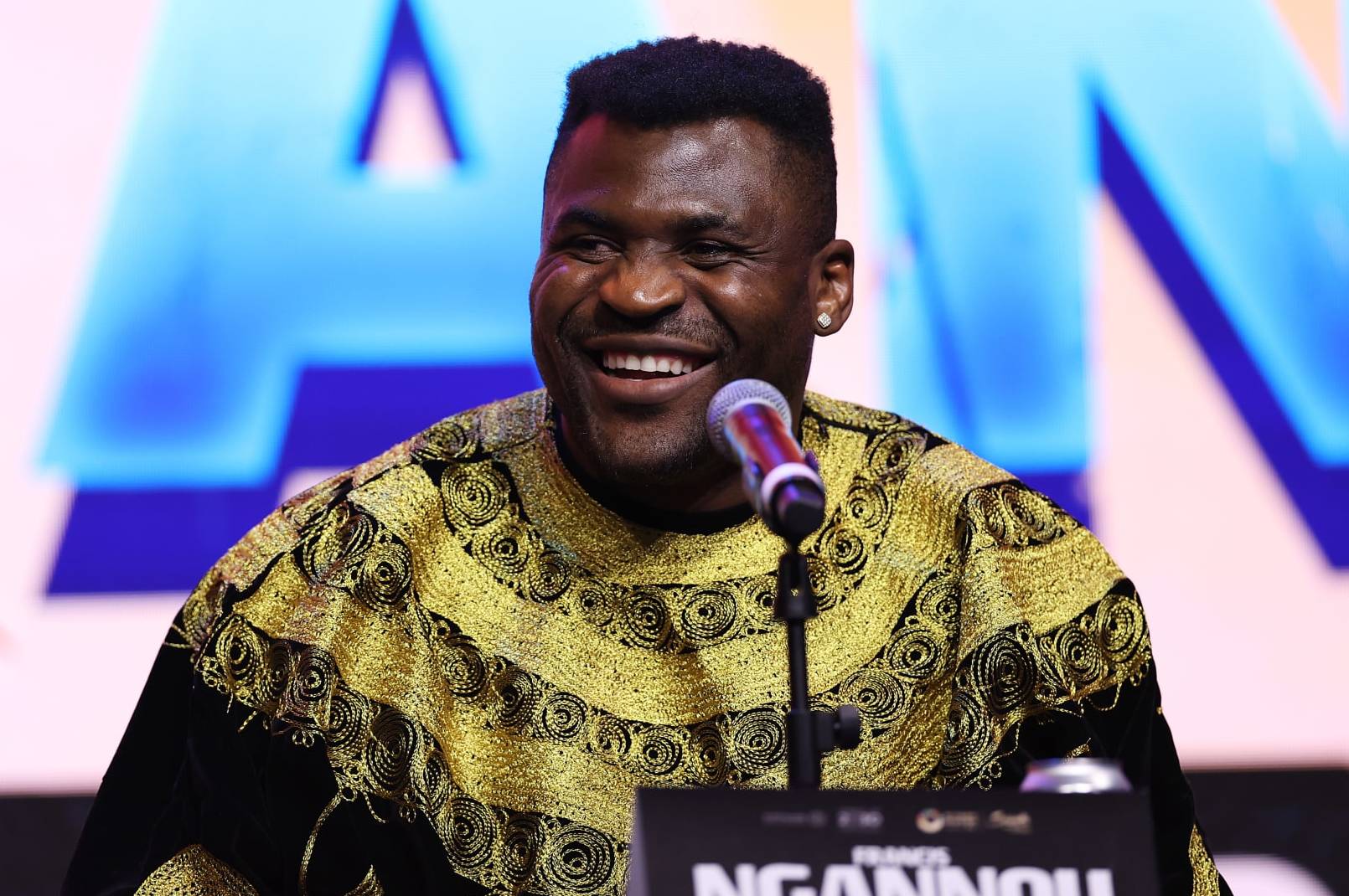 LONDON, ENGLAND - JANUARY 15: Francis Ngannou speaks during the Anthony Joshua v Francis Ngannou Press Conference at Outernet London on January 15, 2024 in London, England. (Photo by Alex Pantling/Getty Images)
