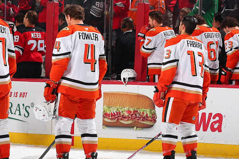 NEWARK, NJ - OCTOBER 27: Olen Zellweger #51 of the Anaheim Ducks, Trevor Zegras #11, Leo Carlsson #91, Cam Fowler #4 and Robby Fabbri #13 of the Anaheim Ducks during the National Anthem prior to the game against the New Jersey Devils at the Prudential Center on October 27, 2024 in Newark, New Jersey. (Photo by Tori Graessle/NHLI via Getty Images)