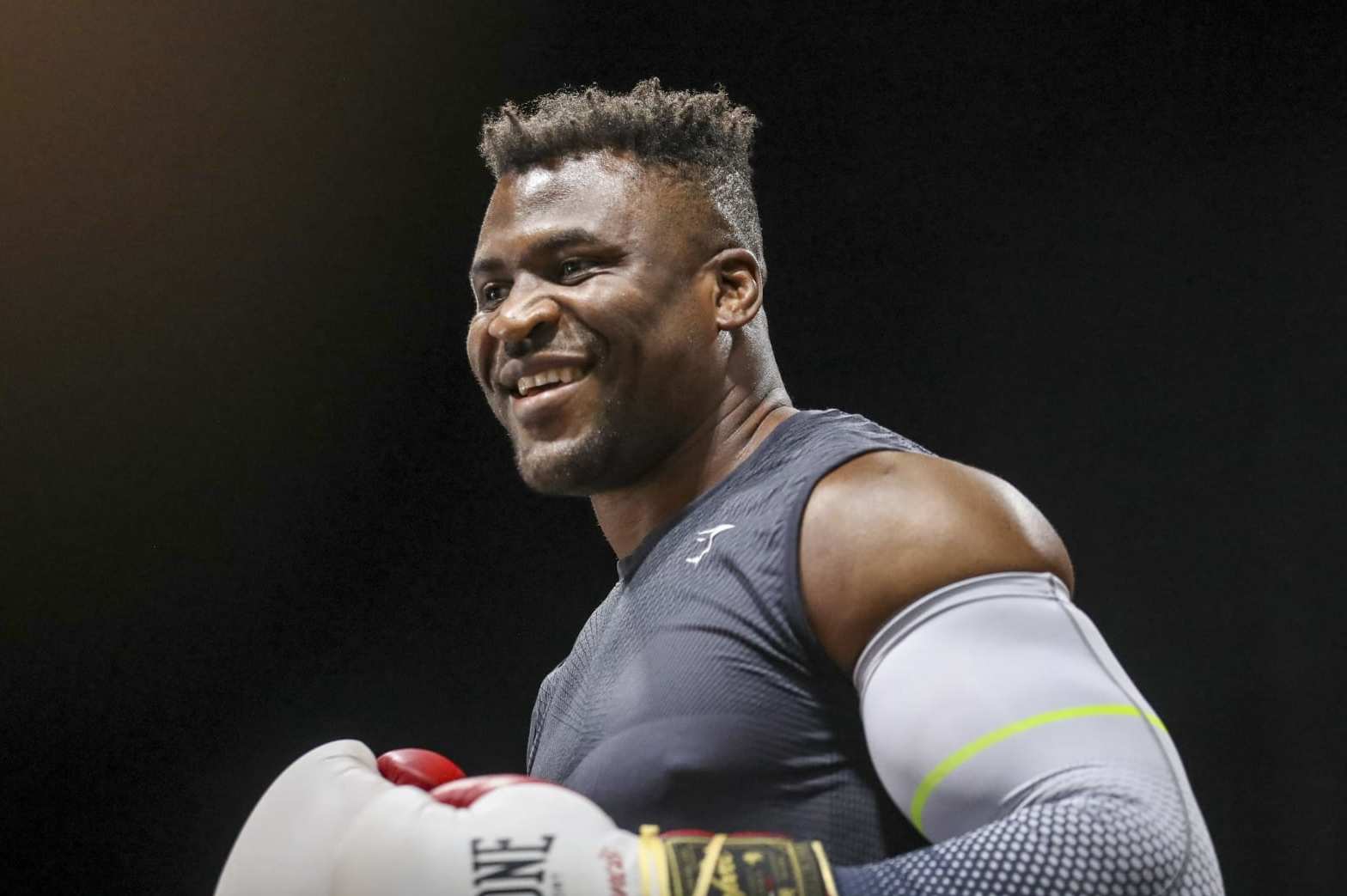 Cameroonian-French mixed martila arts star and boxer Francis Ngannou warms up while former US boxer Mike Tyson speaks to media during a training session at Ngannou's gym in Las Vegas, Nevada, on September 26, 2023. Mixed martial arts star Francis Ngannou will have heavyweight legend Mike Tyson in his corner when he faces World Boxing Council heavyweight champion Tyson Fury in the boxing ring in Saudi Arabia on October 28. (Photo by Ian Maule / AFP) (Photo by IAN MAULE/AFP via Getty Images)