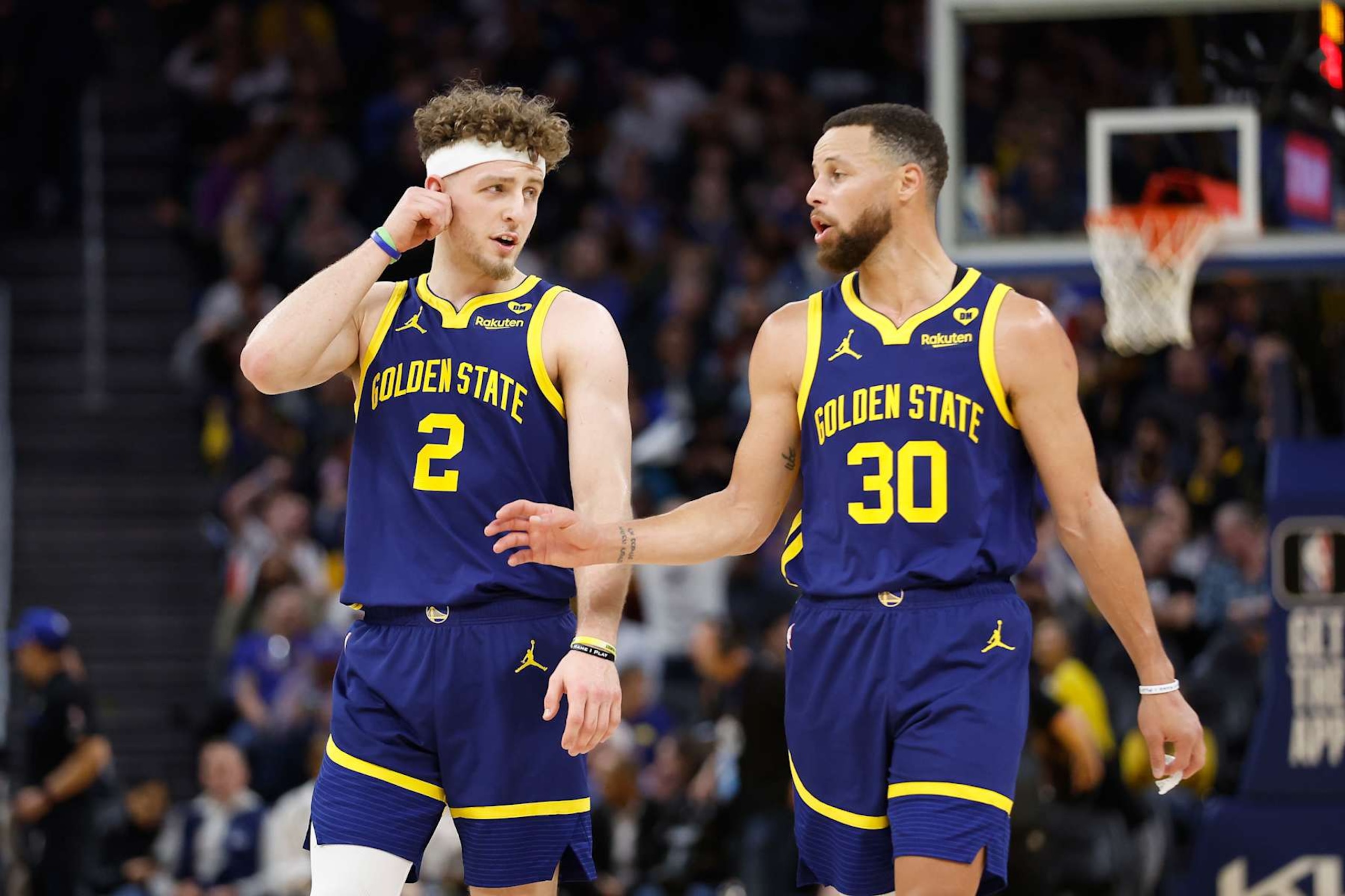 SAN FRANCISCO, CALIFORNIA - FEBRUARY 22: Stephen Curry #30 of the Golden State Warriors talks to teammate Brandin Podziemski #2 in the first half against the Los Angeles Lakers at Chase Center on February 22, 2024 in San Francisco, California. NOTE TO USER: User expressly acknowledges and agrees that, by downloading and or using this photograph, User is consenting to the terms and conditions of the Getty Images License Agreement. (Photo by Lachlan Cunningham/Getty Images) SAN FRANCISCO, CALIFORNIA - FEBRUARY 22: Stephen Curry #30 of the Golden State Warriors talks to teammate Brandin Podziemski #2 in the first half against the Los Angeles Lakers at Chase Center on February 22, 2024 in San Francisco, California. NOTE TO USER: User expressly acknowledges and agrees that, by downloading and or using this photograph, User is consenting to the terms and conditions of the Getty Images License Agreement. (Photo by Lachlan Cunningham/Getty Images)