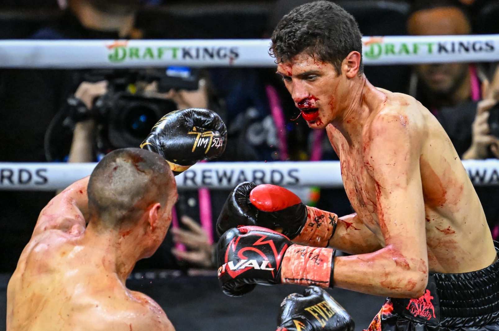 LAS VEGAS, NV - MARCH 30: (EDITORS NOTE: Image depicts graphic content) Tim Tszyu (in gold & black short) and Sebastian Fundora (in red & black short) exchange punches during their super welterweight world titles of the Premiere Boxing Championship on Saturday night as Sebastian Fundora wins at the T-Mobile Arena in Las Vegas, Nevada, United States on March 30, 2024. (Photo by Tayfun Coskun/Anadolu via Getty Images)
