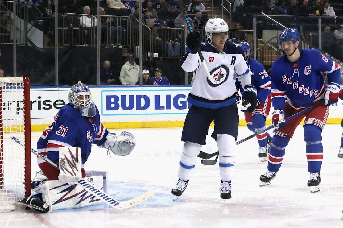NEW YORK, NEW YORK - NOVEMBER 12: Mark Scheifele #55 of the Winnipeg Jets scores a third period goal against Igor Shesterkin #31 of the New York Rangers at Madison Square Garden on November 12, 2024 in New York City. The Jets defeated the Rangers 6-3. (Photo by Bruce Bennett/Getty Images)