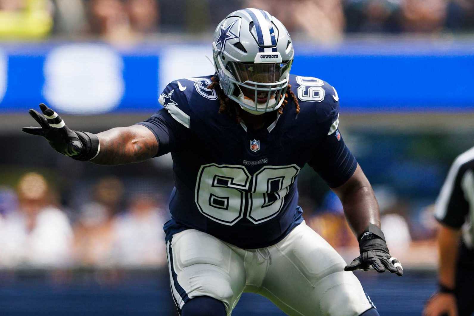INGLEWOOD, CALIFORNIA - AUGUST 11: Tyler Guyton #60 of the Dallas Cowboys blocks during a preseason game against the Los Angeles Rams at SoFi Stadium on August 11, 2024 in Inglewood, California. (Photo by Ric Tapia/Getty Images)