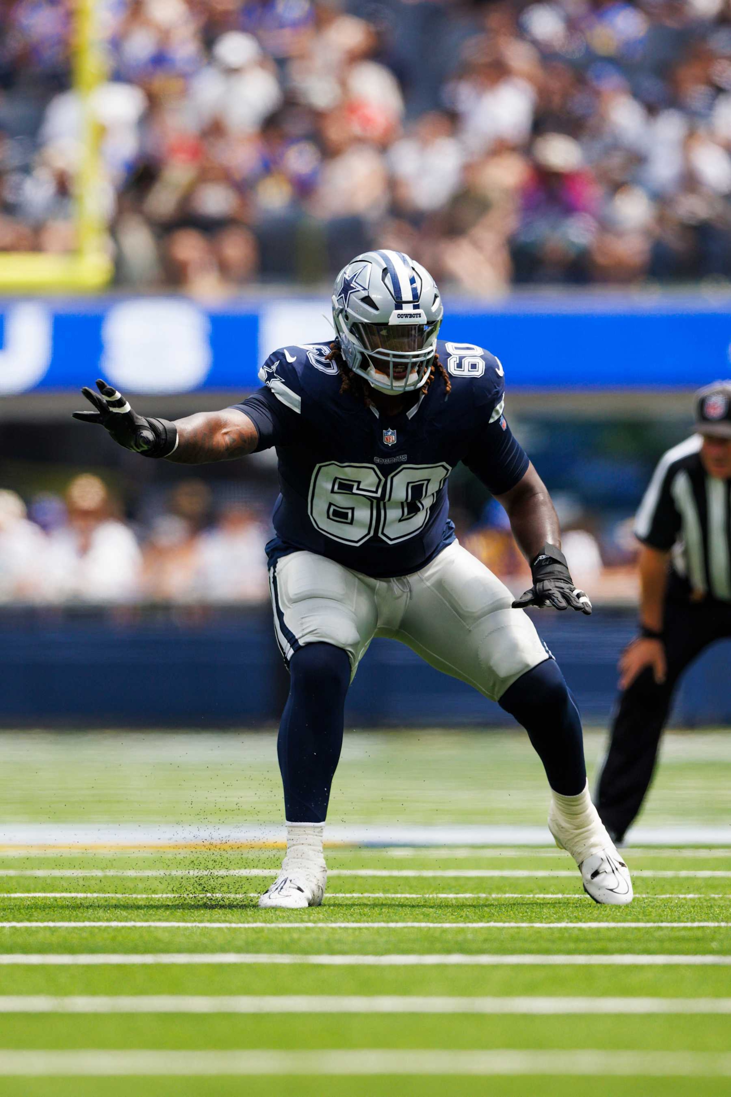 INGLEWOOD, CALIFORNIA - AUGUST 11: Tyler Guyton #60 of the Dallas Cowboys blocks during a preseason game against the Los Angeles Rams at SoFi Stadium on August 11, 2024 in Inglewood, California. (Photo by Ric Tapia/Getty Images)