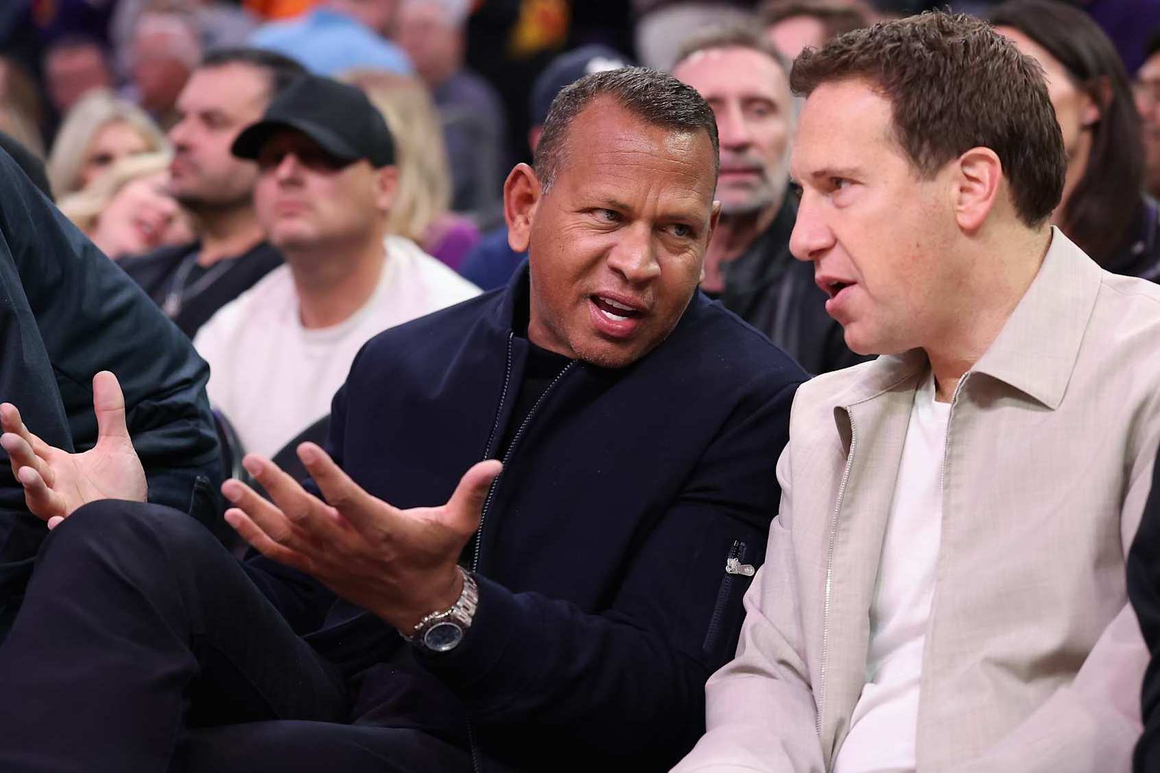 PHOENIX, ARIZONA - JANUARY 29: Former professional baseball player Alex Rodriguez and Phoenix Suns owner Mat Ishbia talk before the NBA game against the Minnesota Timberwolves at Footprint Center on January 29, 2025 in Phoenix, Arizona. NOTE TO USER: User expressly acknowledges and agrees that, by downloading and or using this photograph, User is consenting to the terms and conditions of the Getty Images License Agreement. (Photo by Christian Petersen/Getty Images)