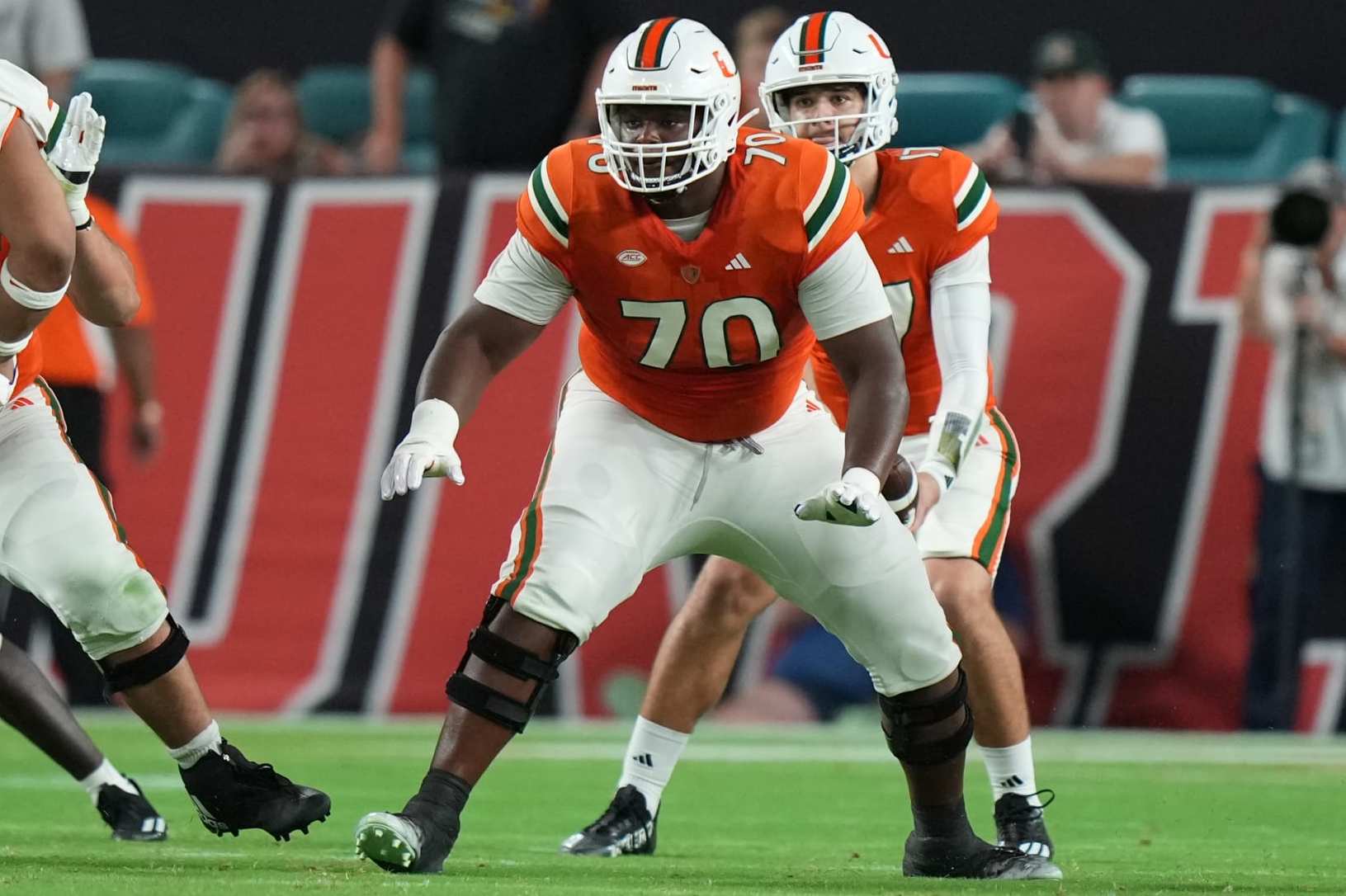 MIAMI GARDENS, FL - OCTOBER 21: Miami Hurricanes offensive lineman Javion Cohen (70) protects the passer during the game between the Clemson Tigers and the Miami Hurricanes on Saturday, October 21, 2023 at Hard Rock Stadium, Miami Gardens, Fla. (Photo by Peter Joneleit/Icon Sportswire via Getty Images)