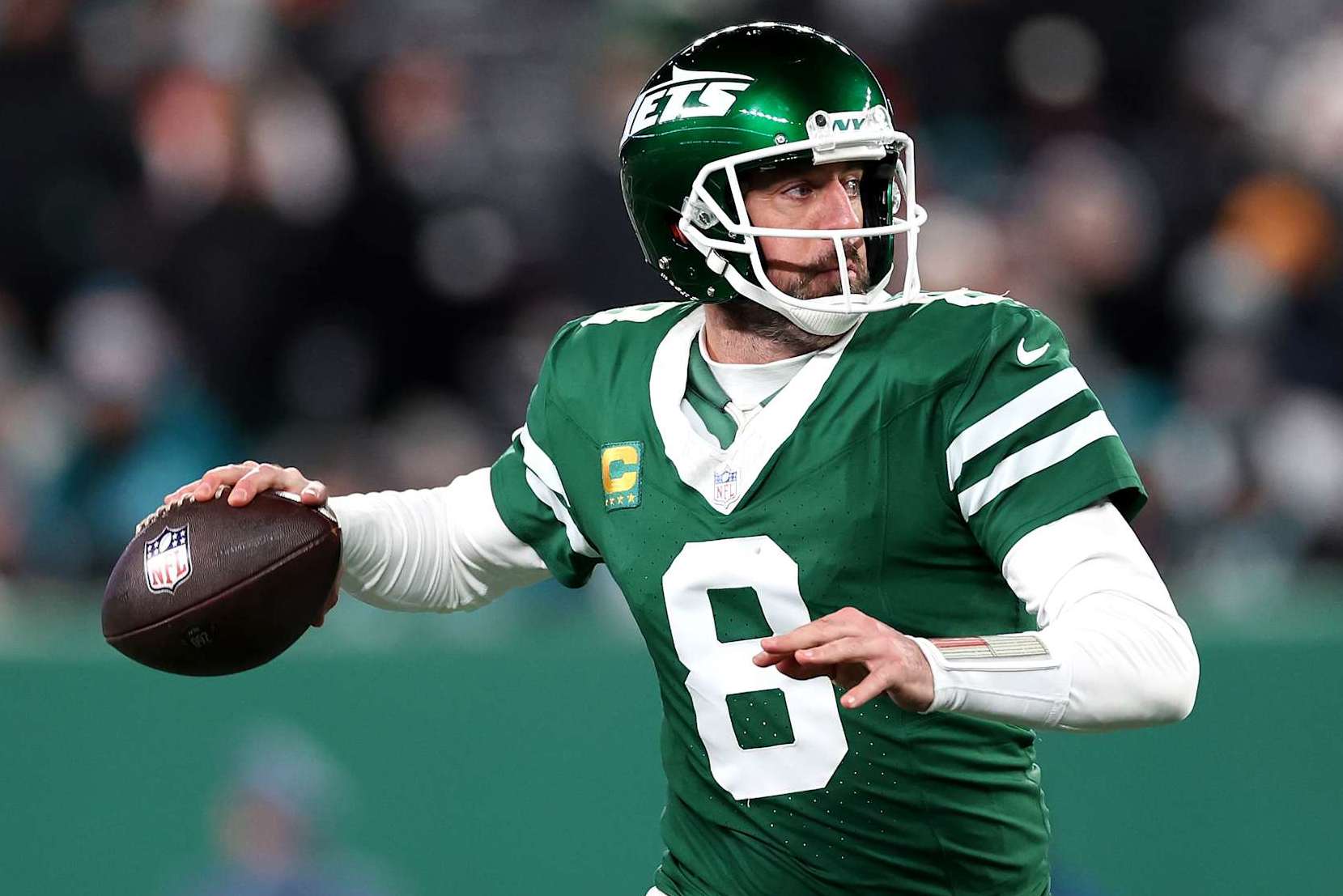EAST RUTHERFORD, NEW JERSEY - JANUARY 05: Aaron Rodgers #8 of the New York Jets in action against the Miami Dolphins at MetLife Stadium on January 05, 2025 in East Rutherford, New Jersey. (Photo by Luke Hales/Getty Images)