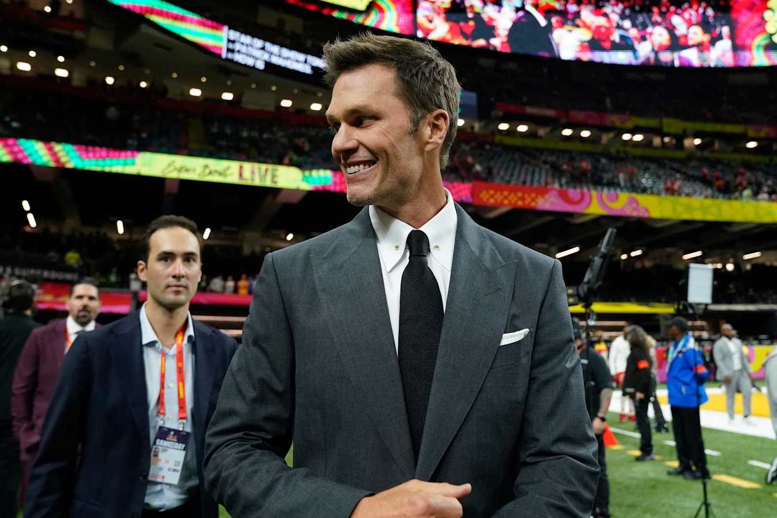 Retired football player and Fox analyst Tom Brady walks the sidelines before the start of Super Bowl LIX between the Kansas City Chiefs and the Philadelphia Eagles at Caesars Superdome in New Orleans, Louisiana, February 9, 2025. (Photo by TIMOTHY A. CLARY / AFP) (Photo by TIMOTHY A. CLARY/AFP via Getty Images)          