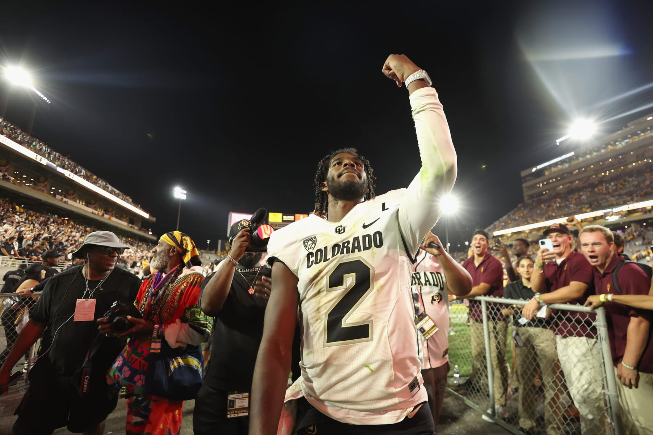 TEMPE, ARIZONA - OCTOBER 07: Quarterback Shedeur Sanders #2 of the Colorado Buffaloes celebrates as he walks off the field following the NCAAF game against the Arizona State Sun Devils at Mountain America Stadium on October 07, 2023 in Tempe, Arizona. The Buffaloes defeated the Sun Devils 27-24. (Photo by Christian Petersen/Getty Images) TEMPE, ARIZONA - OCTOBER 07: Quarterback Shedeur Sanders #2 of the Colorado Buffaloes celebrates as he walks off the field following the NCAAF game against the Arizona State Sun Devils at Mountain America Stadium on October 07, 2023 in Tempe, Arizona. The Buffaloes defeated the Sun Devils 27-24. (Photo by Christian Petersen/Getty Images)