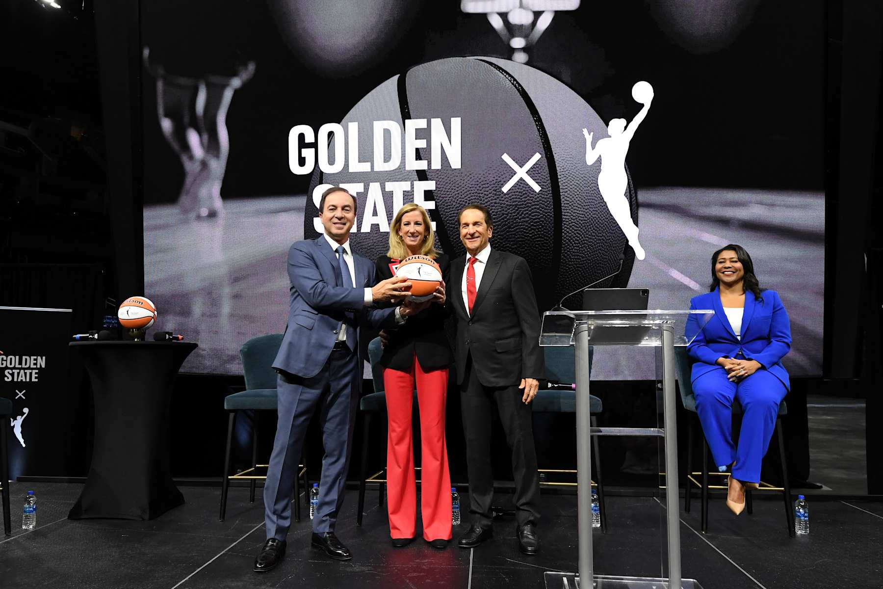SAN FRANCISCO, CA - OCTOBER 5:  Cathy Engelbert poses with Joe Lacob and Peter Guber of the Golden State Warriors during the WNBA press conference announcing the Golden State Warriors will begin a Bay Area expansion team to begin play in 2025 on October 5, 2023 at the Chase Center in San Francisco, California. NOTE TO USER: User expressly acknowledges and agrees that, by downloading and or using this photograph, user is consenting to the terms and conditions of Getty Images License Agreement. Mandatory Copyright Notice: Copyright 2023 NBAE (Photo by Noah Graham/NBAE via Getty Images)