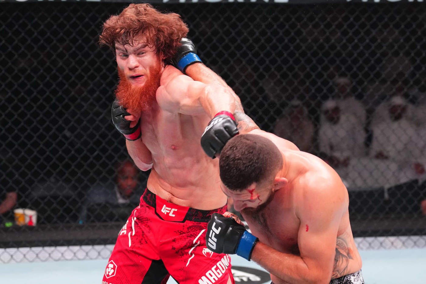 ABU DHABI, UNITED ARAB EMIRATES - AUGUST 03: (L-) Shara Magomedov of Russia punches Michal Oleksiejczuk of Poland in a middleweight fight during the UFC Fight Night event at Etihad Arena on August 03, 2024 in Abu Dhabi, United Arab Emirates. (Photo by Josh Hedges/Zuffa LLC via Getty Images)