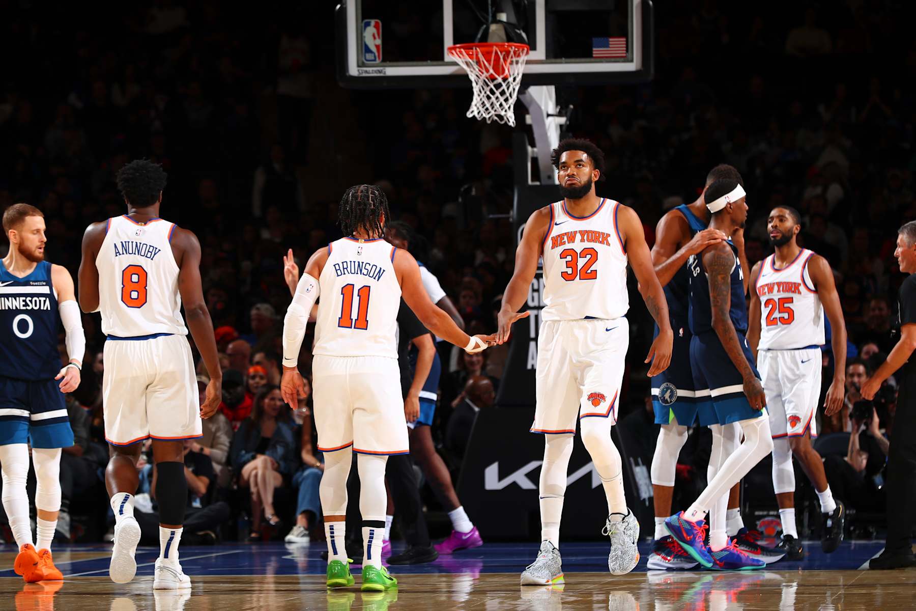 NEW YORK, NY - OCTOBER 13: Karl-Anthony Towns #32 of the New York Knicks high-fives teammate Jalen Brunson #11 during the game on October 13, 2024 at Madison Square Garden in New York City, New York.  NOTE TO USER: User expressly acknowledges and agrees that, by downloading and or using this photograph, User is consenting to the terms and conditions of the Getty Images License Agreement. Mandatory Copyright Notice: Copyright 2024 NBAE  (Photo by David L. Nemec/NBAE via Getty Images)