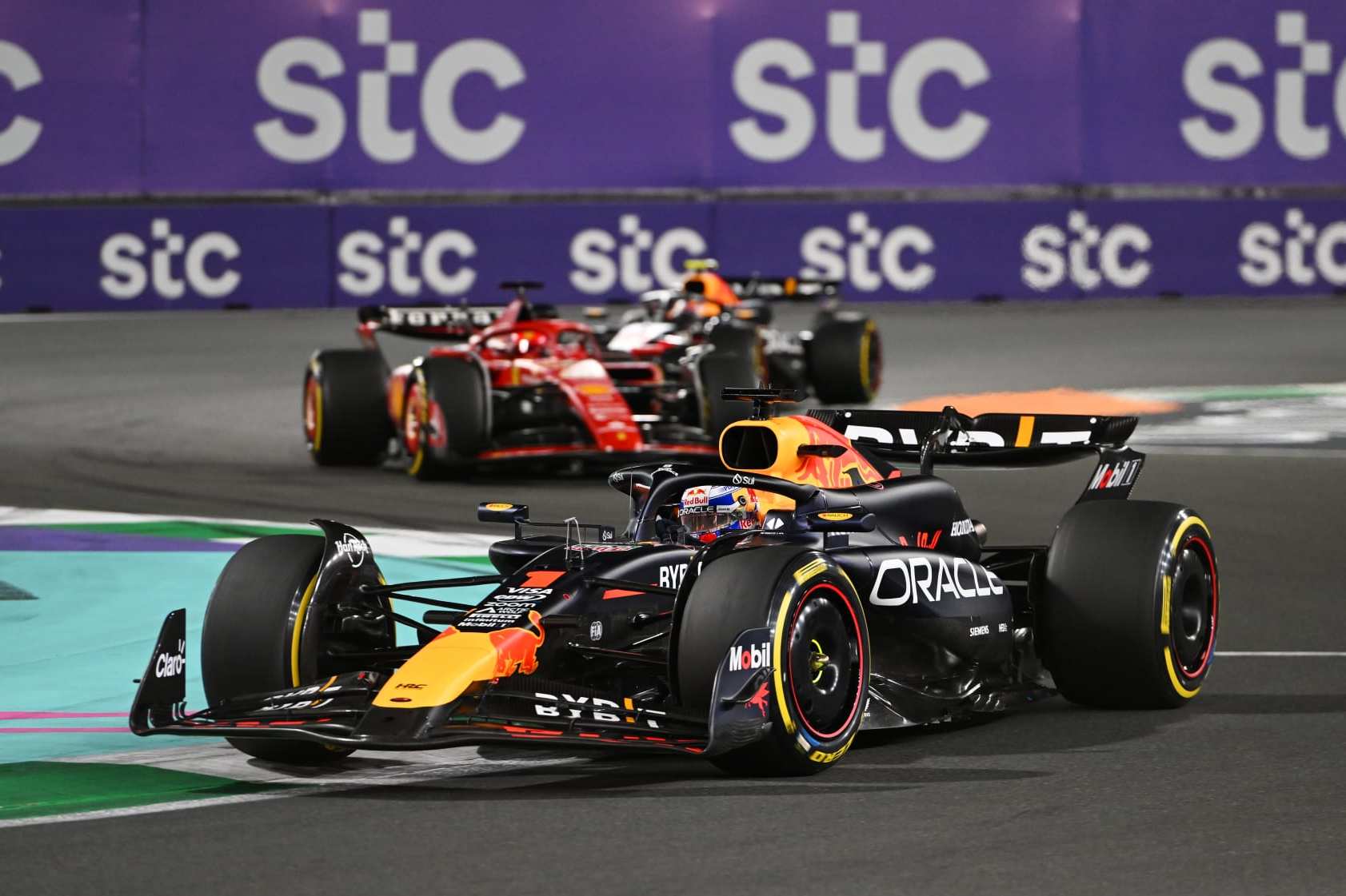 JEDDAH, SAUDI ARABIA - MARCH 09: Max Verstappen of the Netherlands driving the (1) Oracle Red Bull Racing RB20 leads Charles Leclerc of Monaco driving the (16) Ferrari SF-24 during the F1 Grand Prix of Saudi Arabia at Jeddah Corniche Circuit on March 09, 2024 in Jeddah, Saudi Arabia. (Photo by Rudy Carezzevoli/Getty Images)