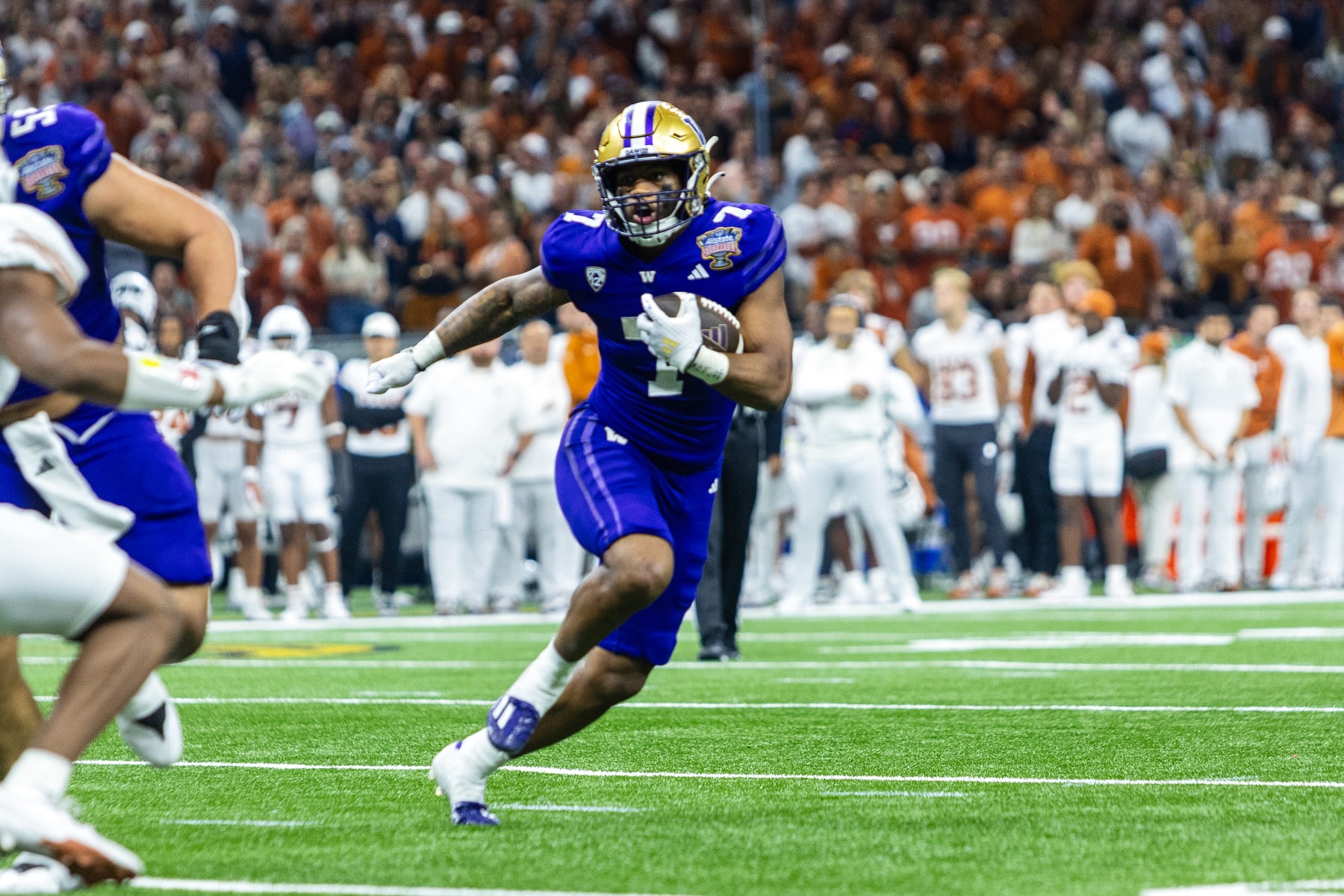 NEW ORLEANS, LA - JANUARY 01: Washington Huskies running back Dillon Johnson (7) rushes the ball during a game between the Texas Longhorns and the Washington Huskies on January 1, 2024, at the Caesars Superdome in New Orleans, LA. (Photo by John Korduner/Icon Sportswire via Getty Images)