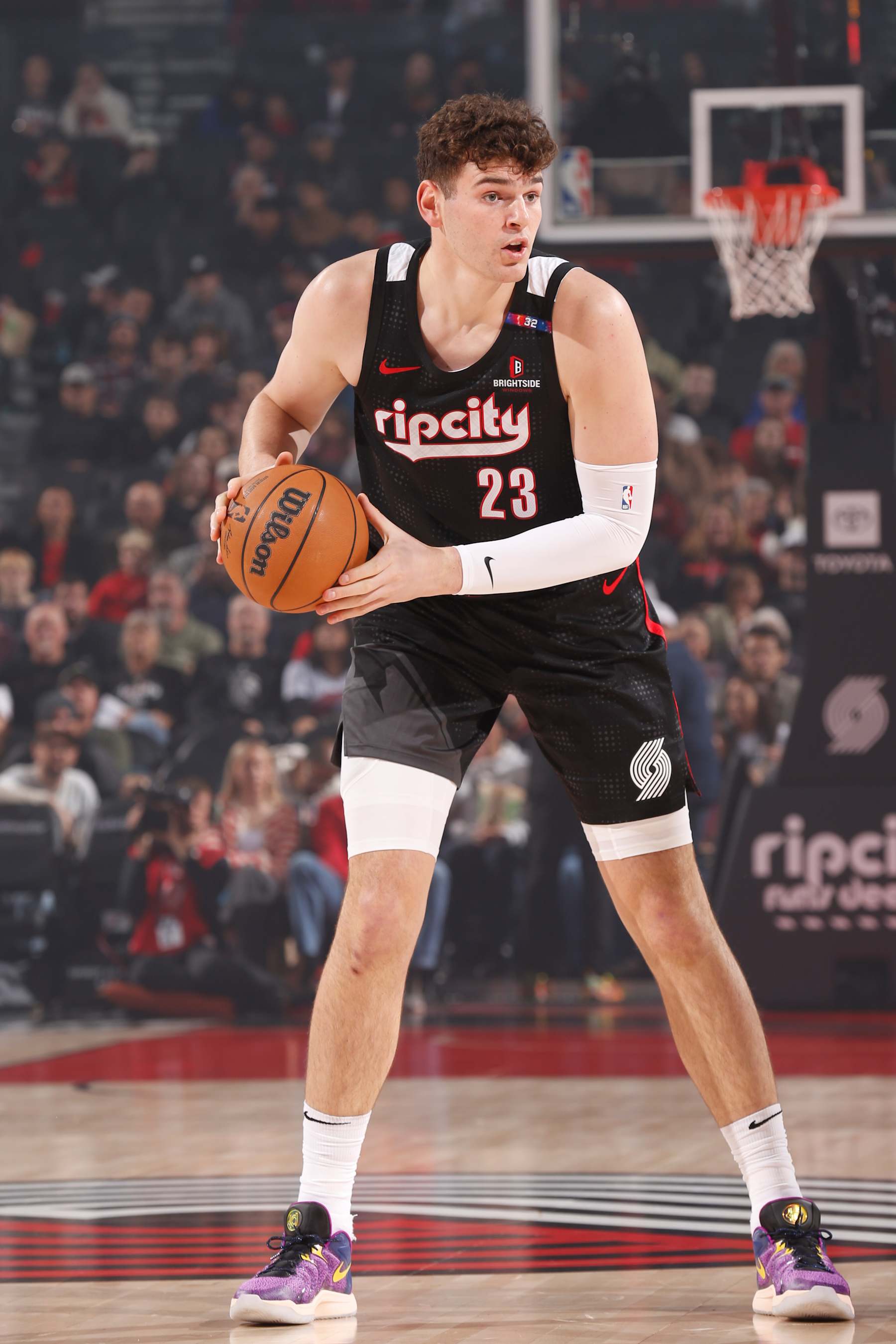 PORTLAND, OR - November 17:  Donovan Clingan #23 of the Portland Trail Blazers handles the ball during the game against the Atlanta Hawks on November 17, 2024 at the Moda Center Arena in Portland, Oregon. NOTE TO USER: User expressly acknowledges and agrees that, by downloading and or using this photograph, user is consenting to the terms and conditions of the Getty Images License Agreement. Mandatory Copyright Notice: Copyright 2024 NBAE (Photo by Cameron Browne/NBAE via Getty Images)