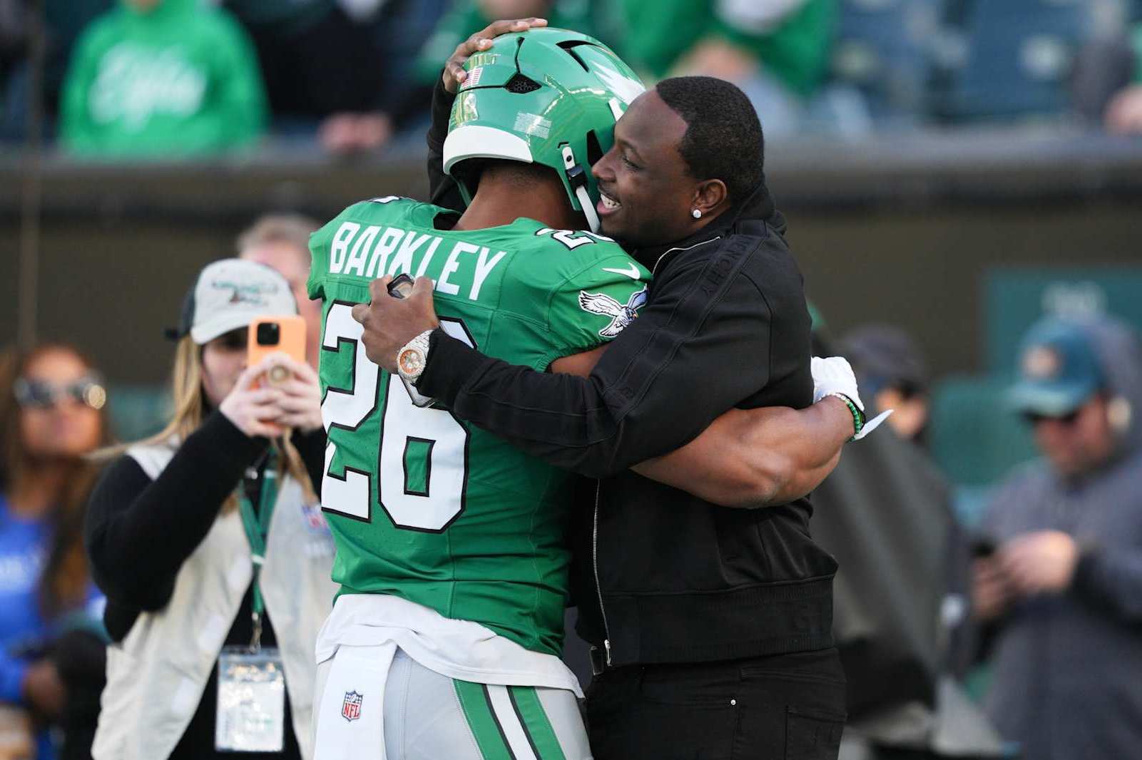 PHILADELPHIA, PA - NOVEMBER 03: Philadelphia Eagles running back Saquon Barkley (26) hugs Philadelphia Eagles Hall of Fame running back LeSean McCoy during the game between the Philadelphia Eagles and the Jacksonville Jaguars on November 3, 2024 at Lincoln Financial Field in Philadelphia, PA. (Photo by Andy Lewis/Icon Sportswire via Getty Images)
